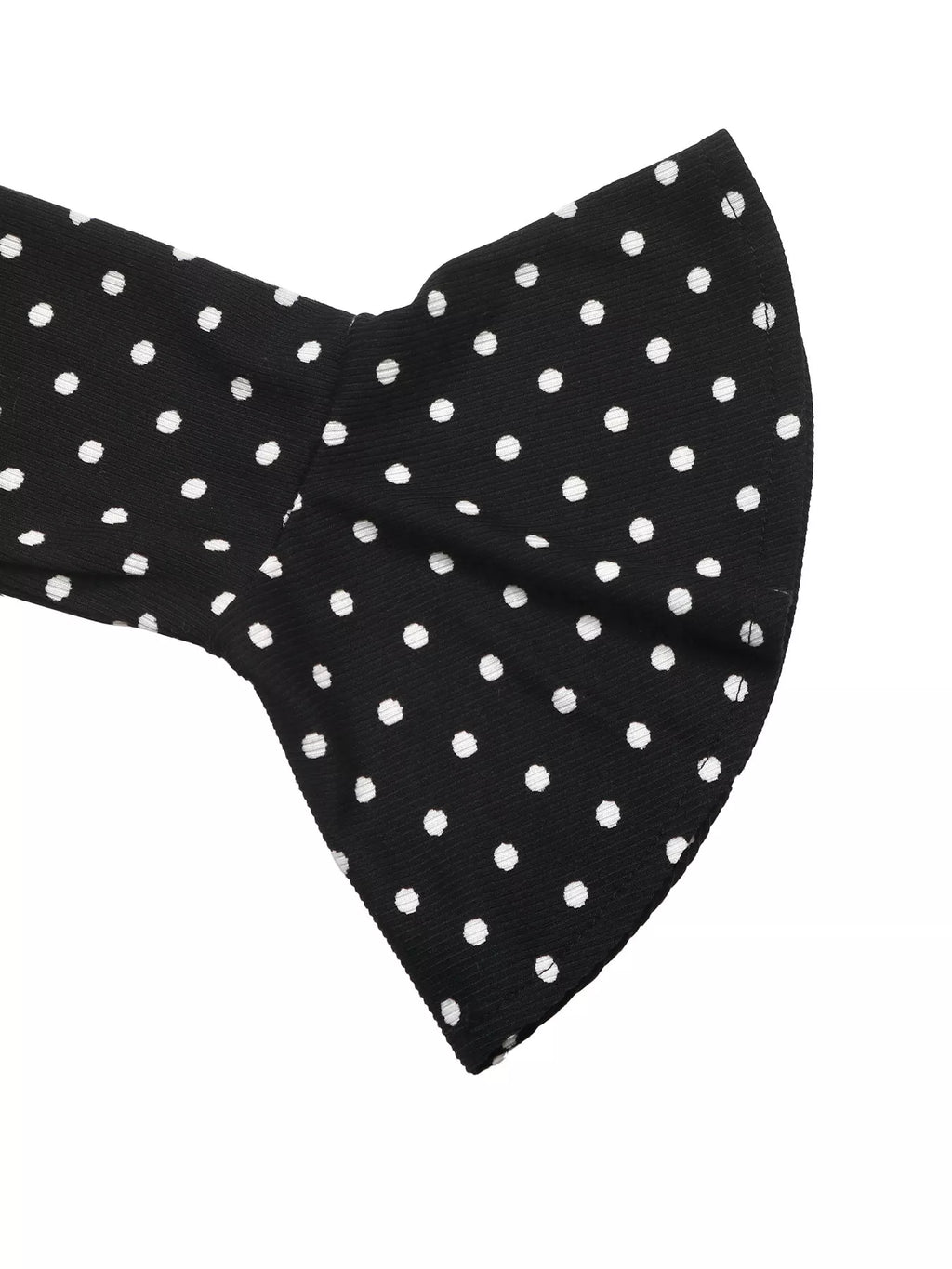 View 8 of the black long-sleeve polka-dot mini dress with a deep V and ruffled cuffs.