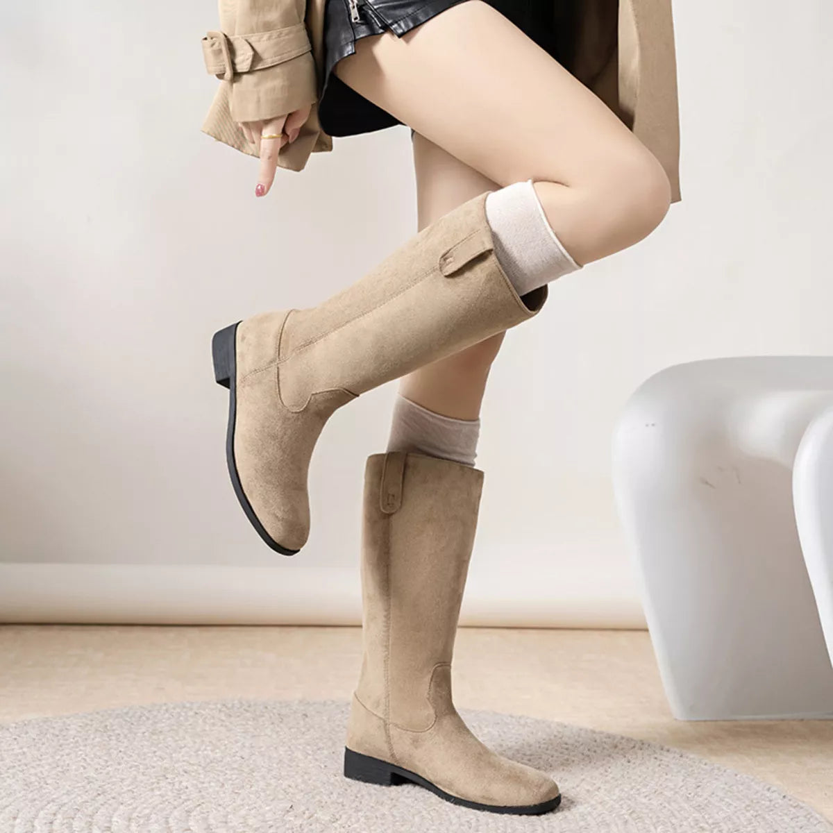 View 6 of the suede pull-on boots with a round toe and a mid heel.