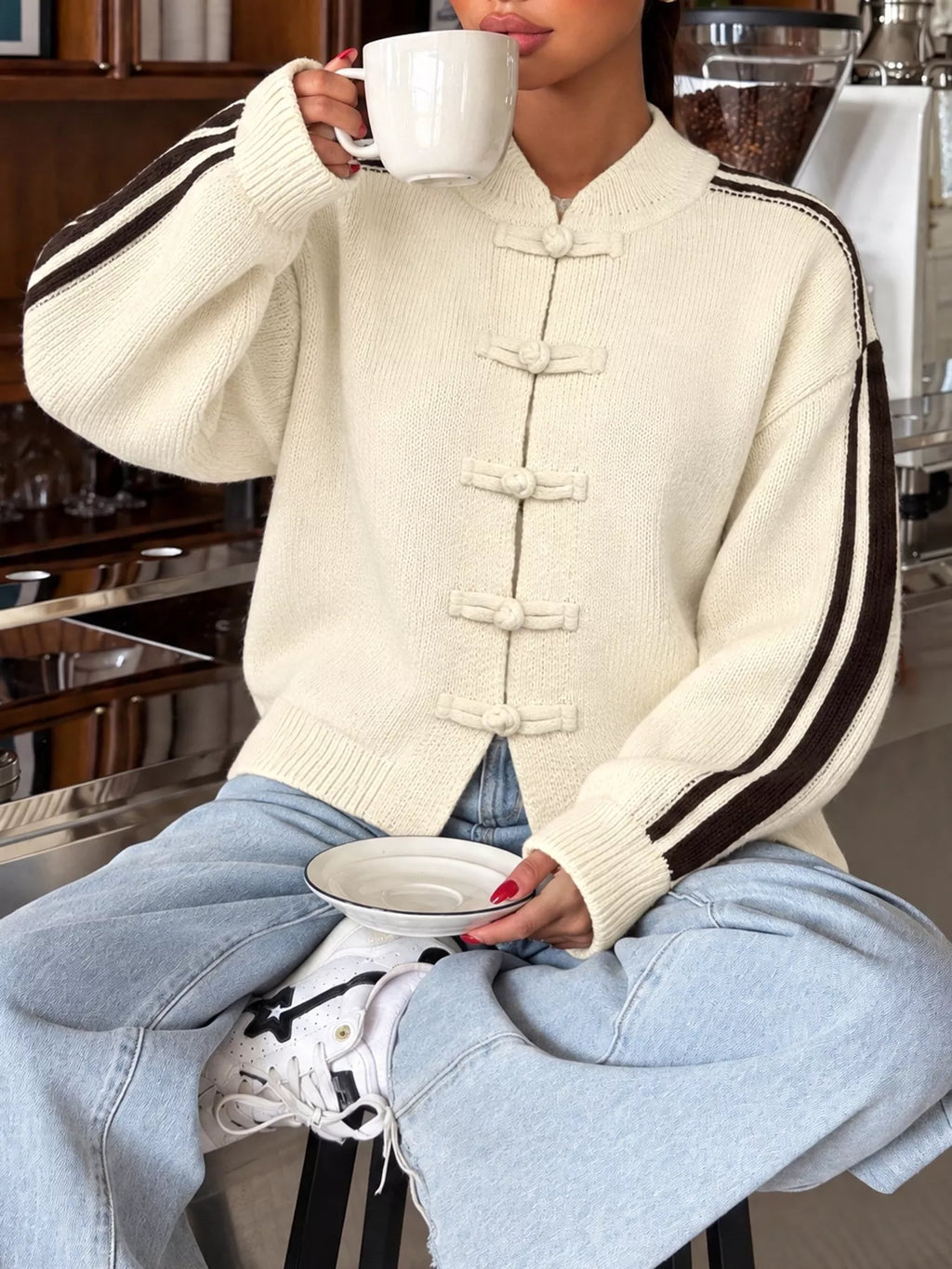 Cardigan with Chinese knot buttons and contrast stripes down the sides.