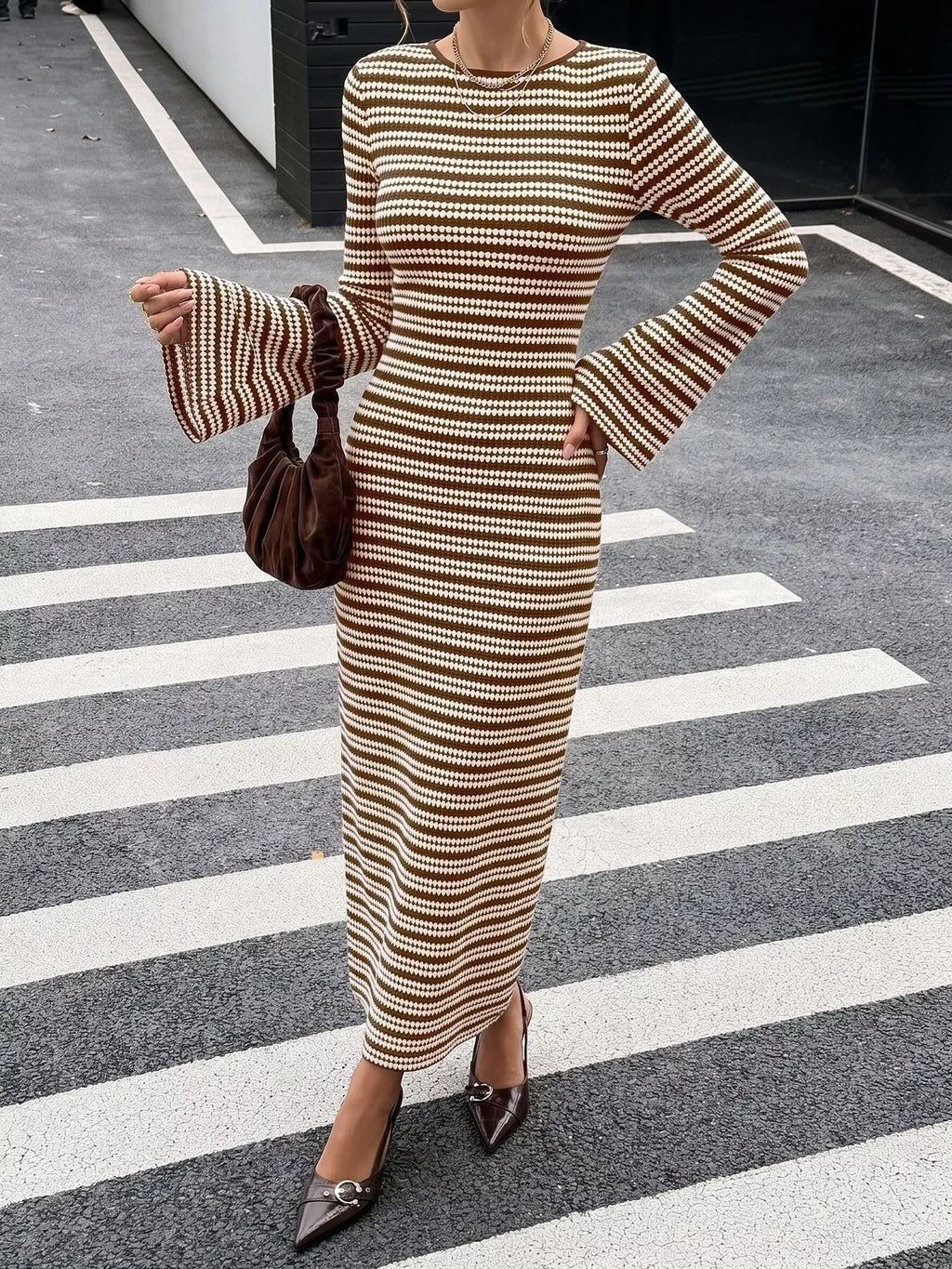 Striped ribbed knit dress with flare sleeves.