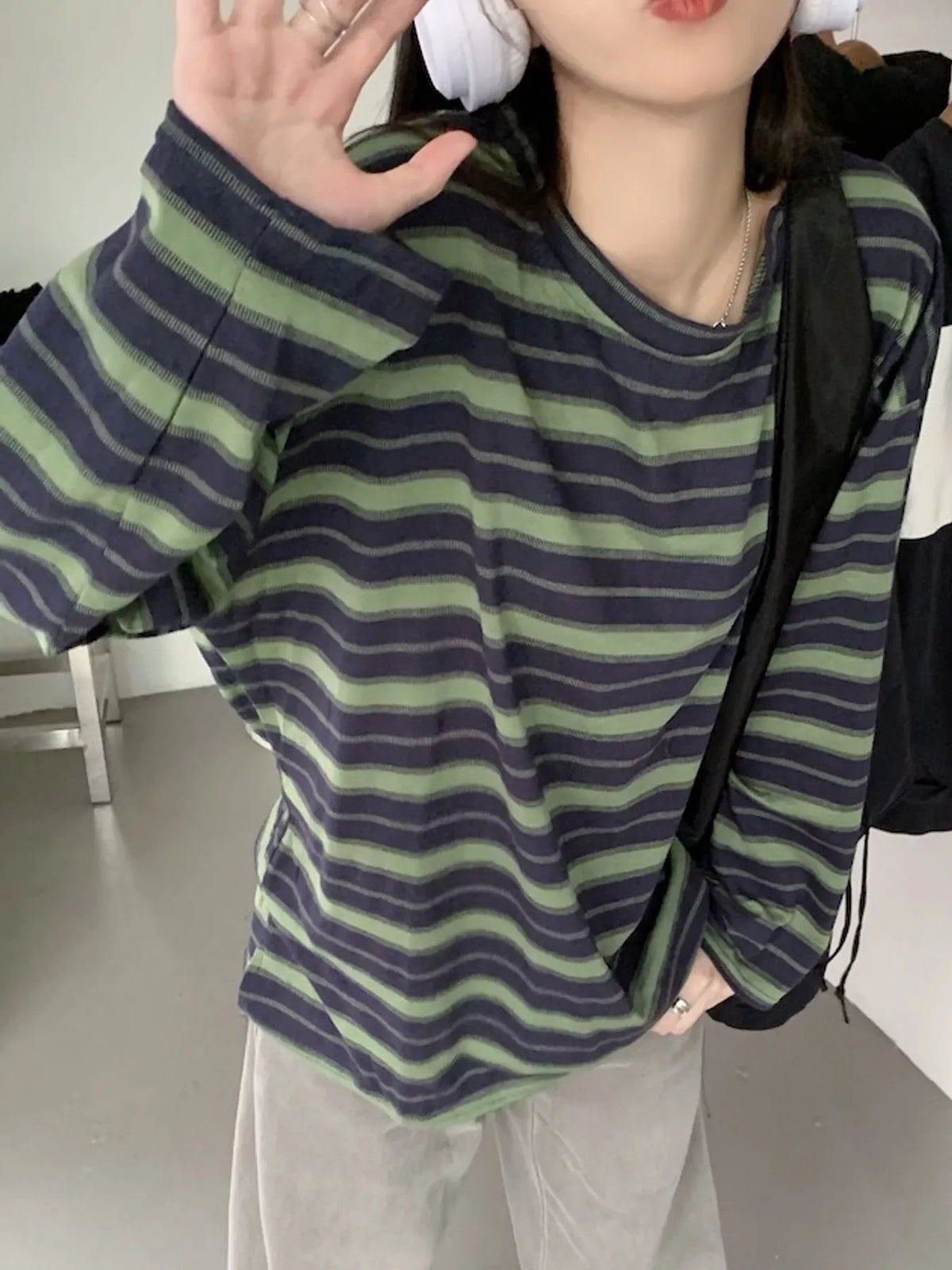 View 7 of the oversized navy-and-cream striped tee with dropped shoulders.