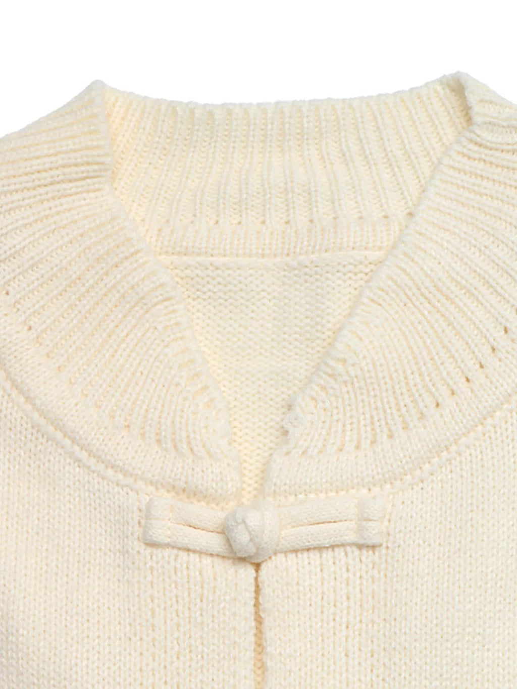 View 7 of the cardigan with Chinese knot buttons and contrast stripes down the sides.