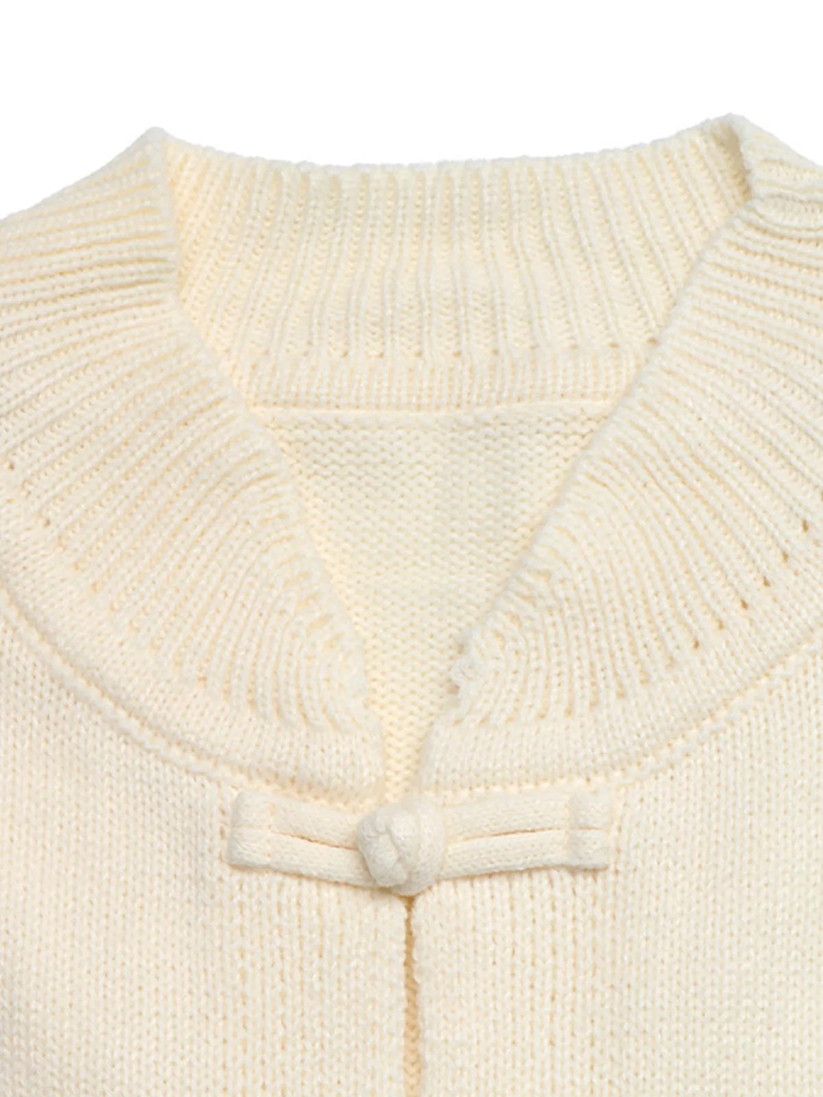 View 7 of the cardigan with Chinese knot buttons and contrast stripes down the sides.