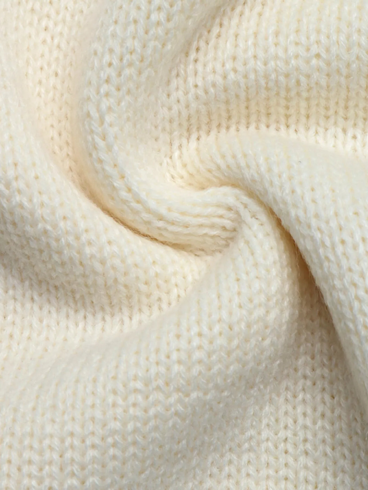 View 11 of the cardigan with Chinese knot buttons and contrast stripes down the sides.