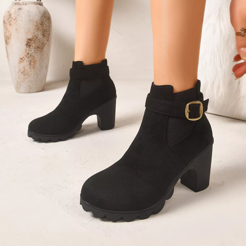 View 2 of the suede boots with a round toe and a high block heel.