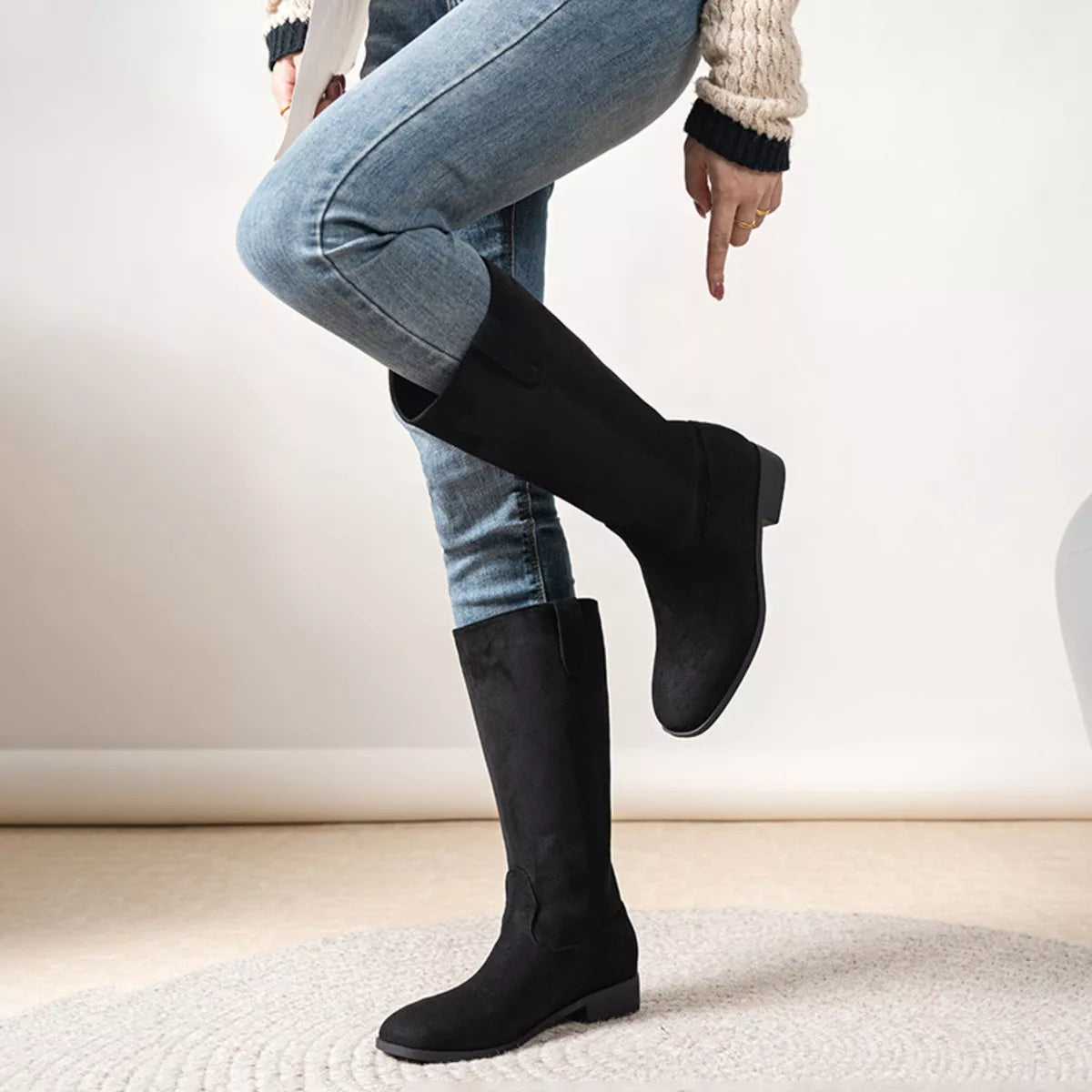 View 4 of the suede pull-on boots with a round toe and a mid heel.