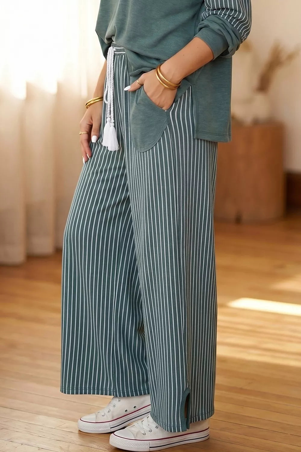 View 4 of the striped two-piece set with a long-sleeve top and drawstring pants.