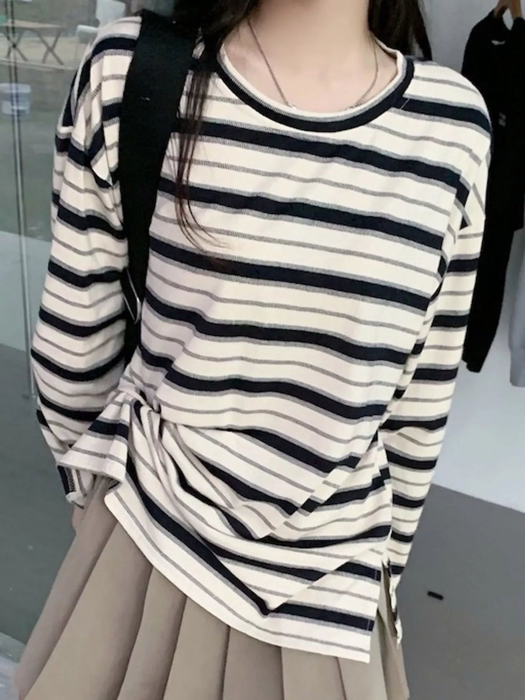 View 2 of the oversized navy-and-cream striped tee with dropped shoulders.