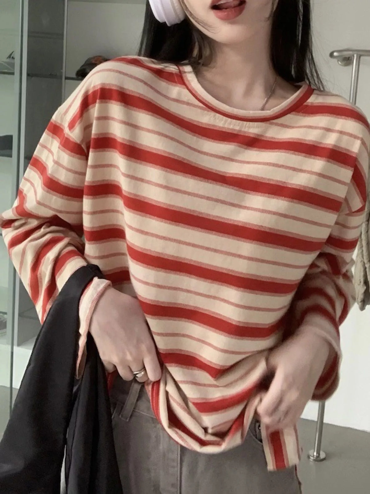 View 14 of the oversized navy-and-cream striped tee with dropped shoulders.