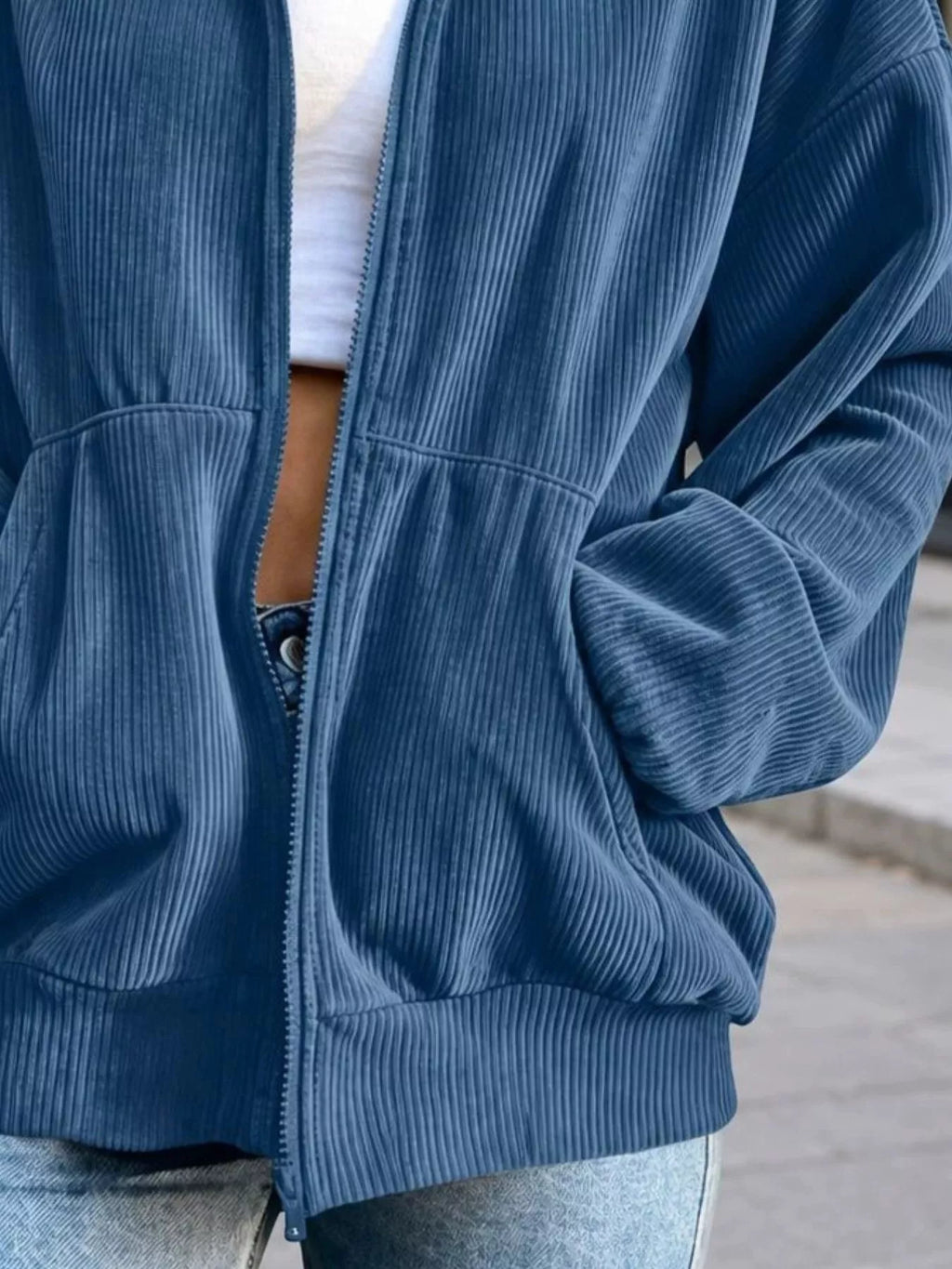 View 18 of the unlined corduroy zip jacket with dropped shoulders and pockets.
