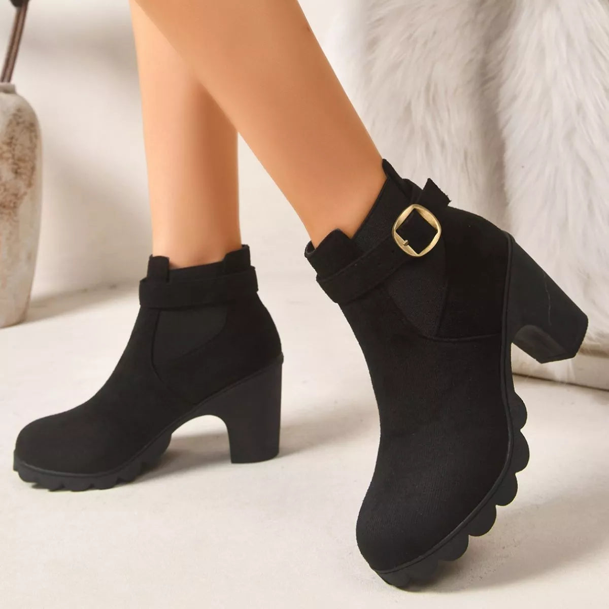View 3 of the suede boots with a round toe and a high block heel.