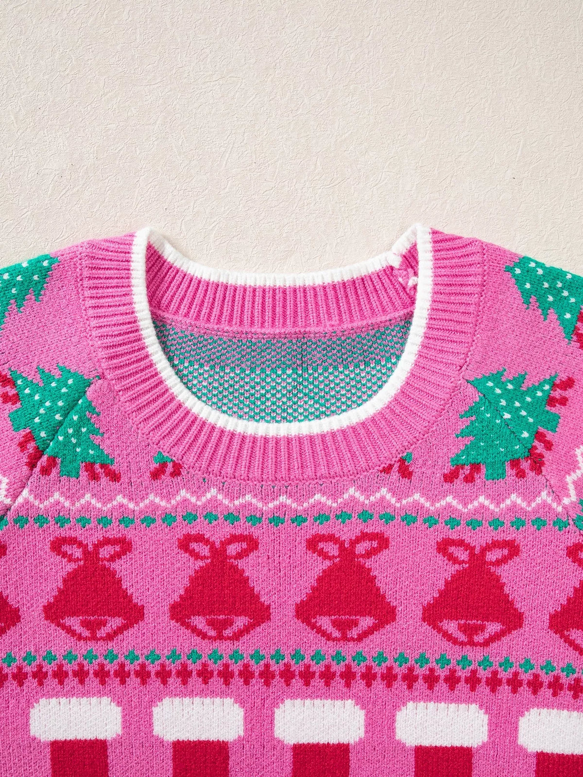 View 5 of the round-neck holiday knit sweater with a graphic across the chest.