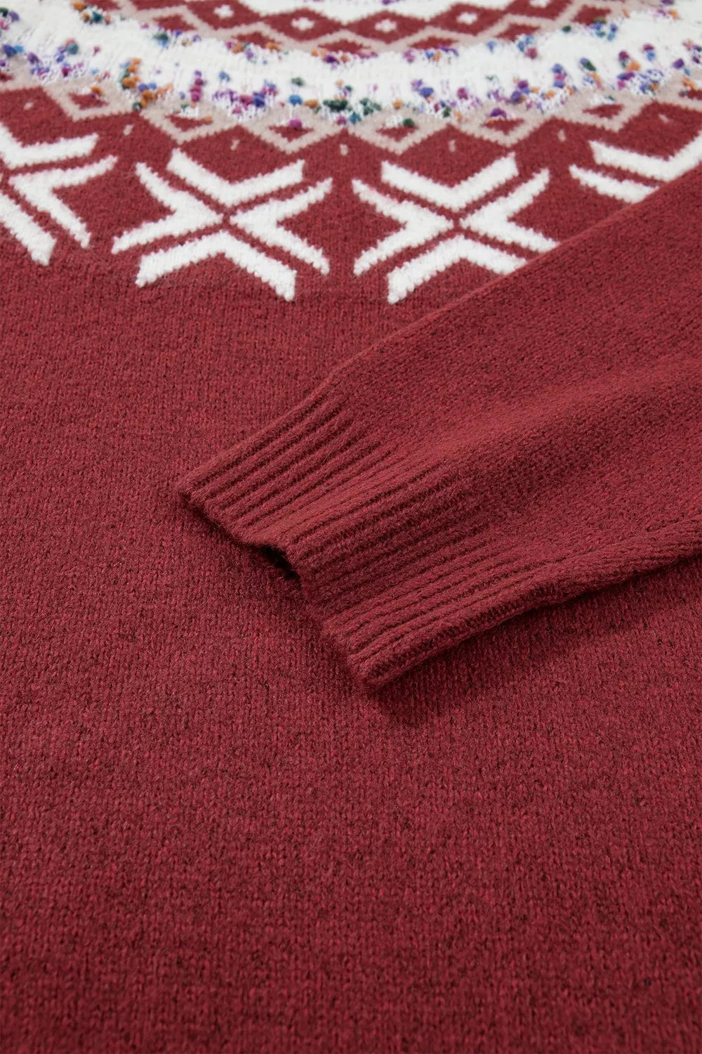 View 10 of the burgundy crewneck sweater with a white snowflake geometric band and a fair-isle yoke.