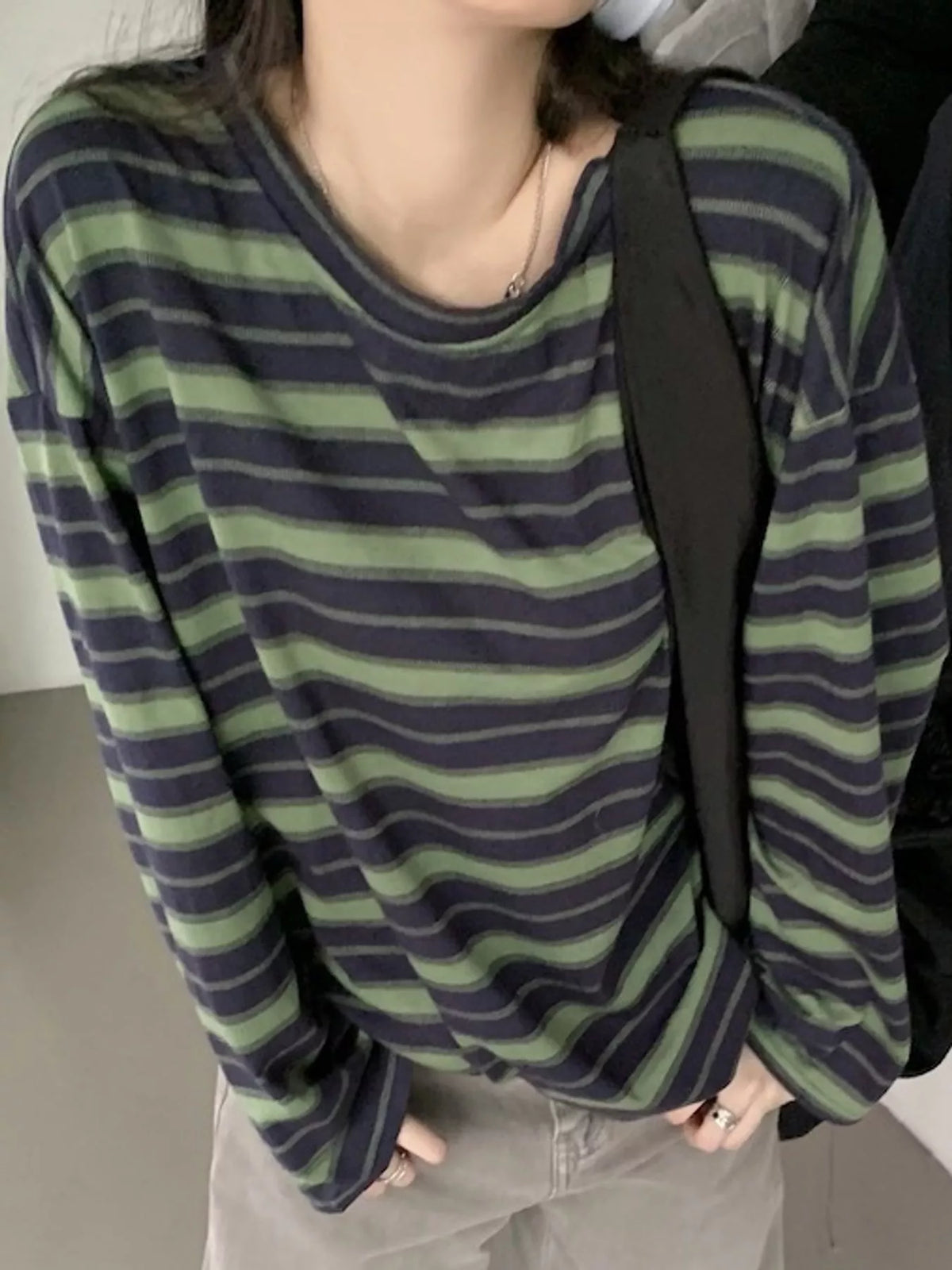 View 8 of the oversized navy-and-cream striped tee with dropped shoulders.