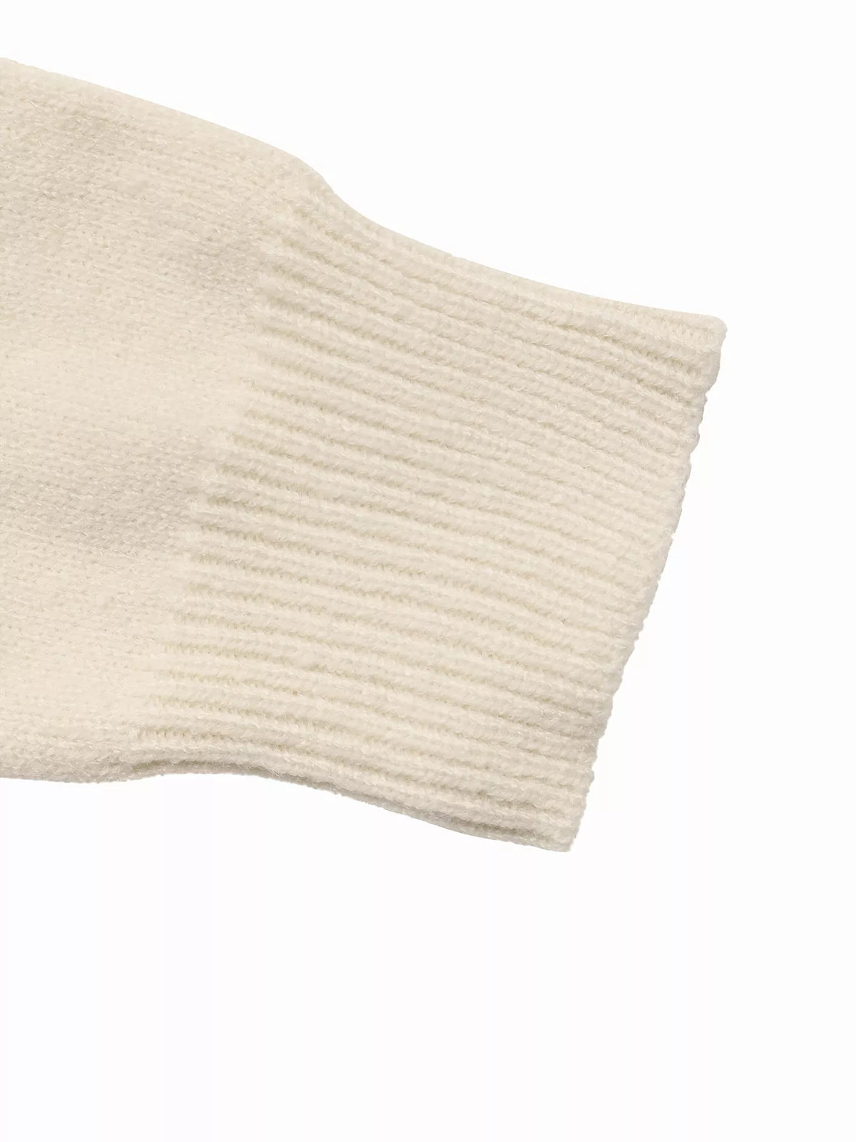 View 9 of the crewneck sweater with a heart pattern through the knit.