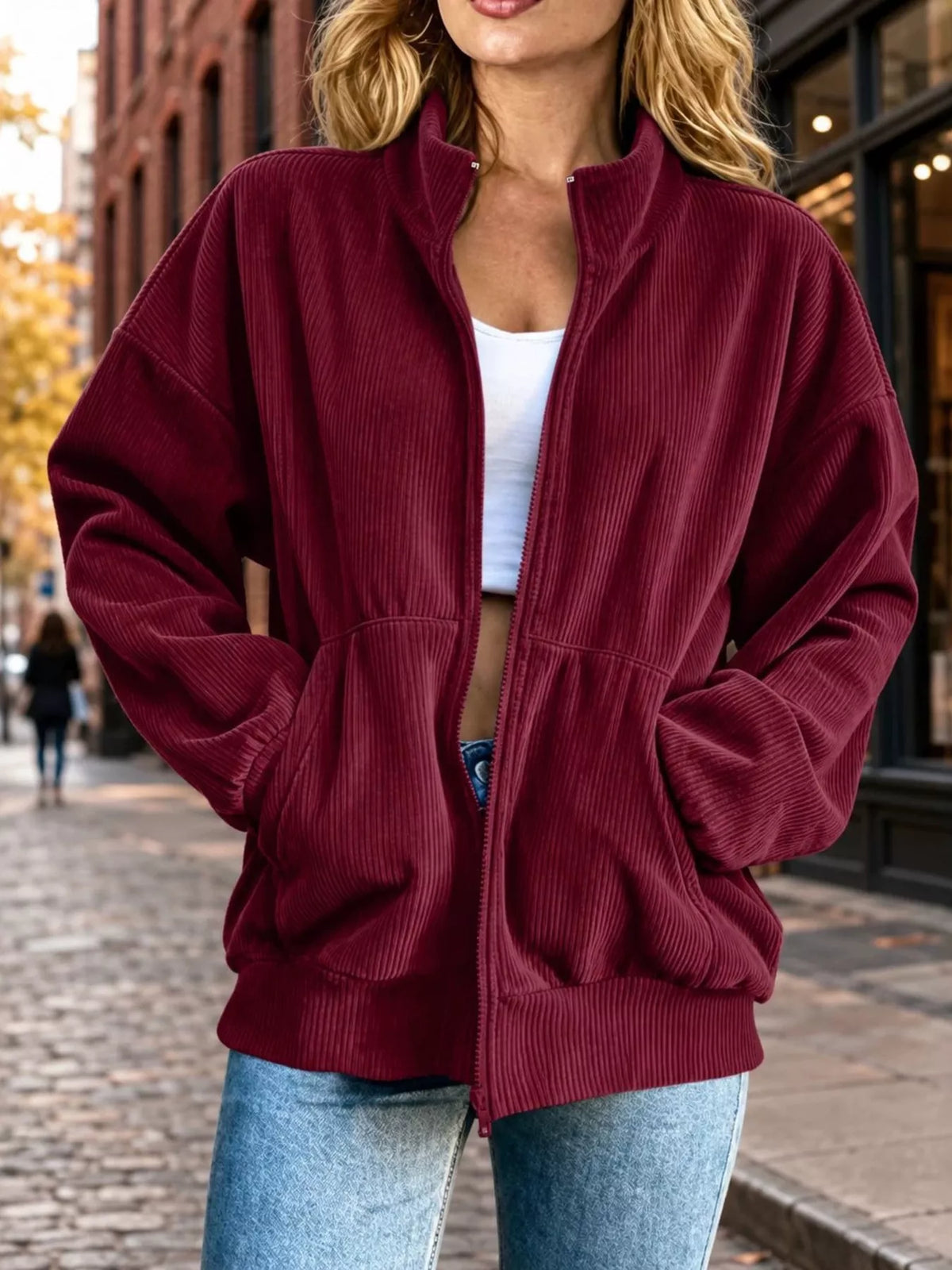 View 4 of the unlined corduroy zip jacket with dropped shoulders and pockets.