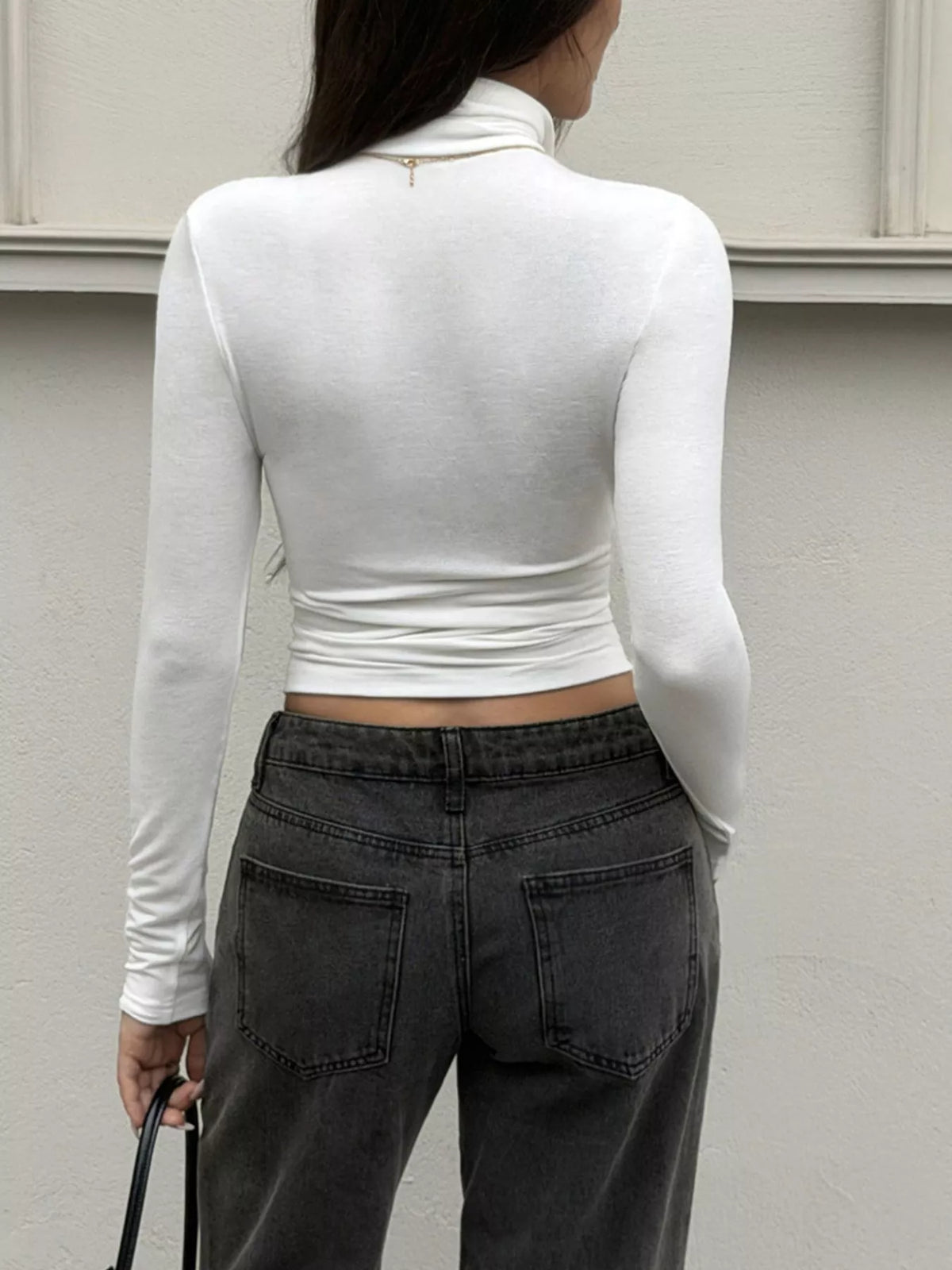 View 5 of the fitted white cropped turtleneck with long sleeves.