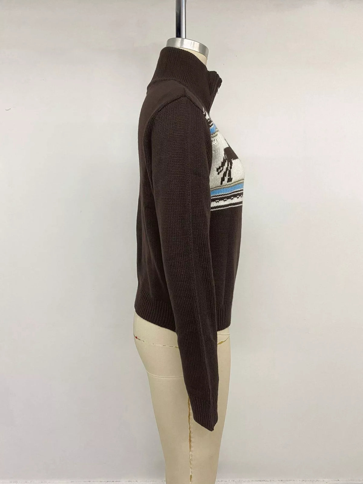 View 12 of the brown zip mock-neck cardigan with black horses on a cream chest band.