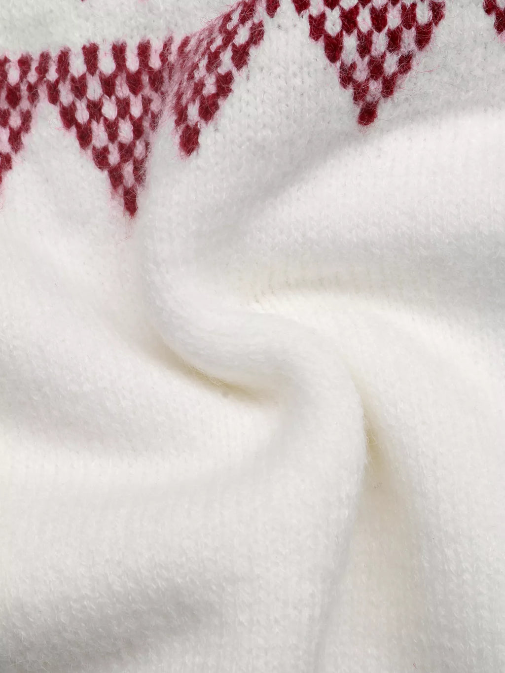 View 12 of the crewneck knit sweater covered in a geometric pattern.