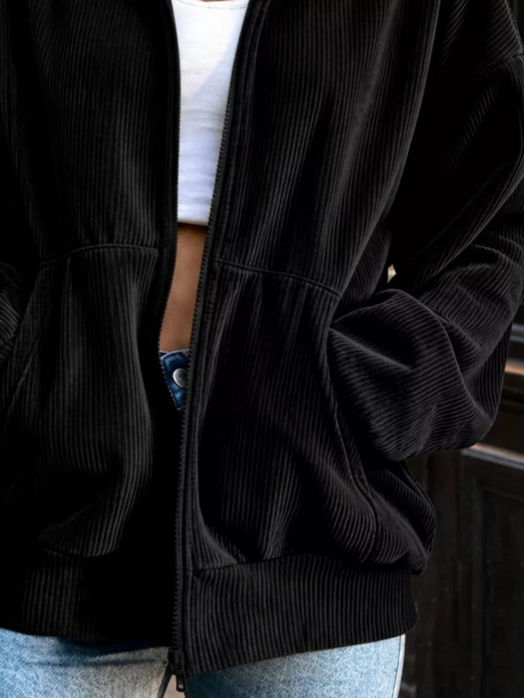 View 3 of the unlined corduroy zip jacket with dropped shoulders and pockets.