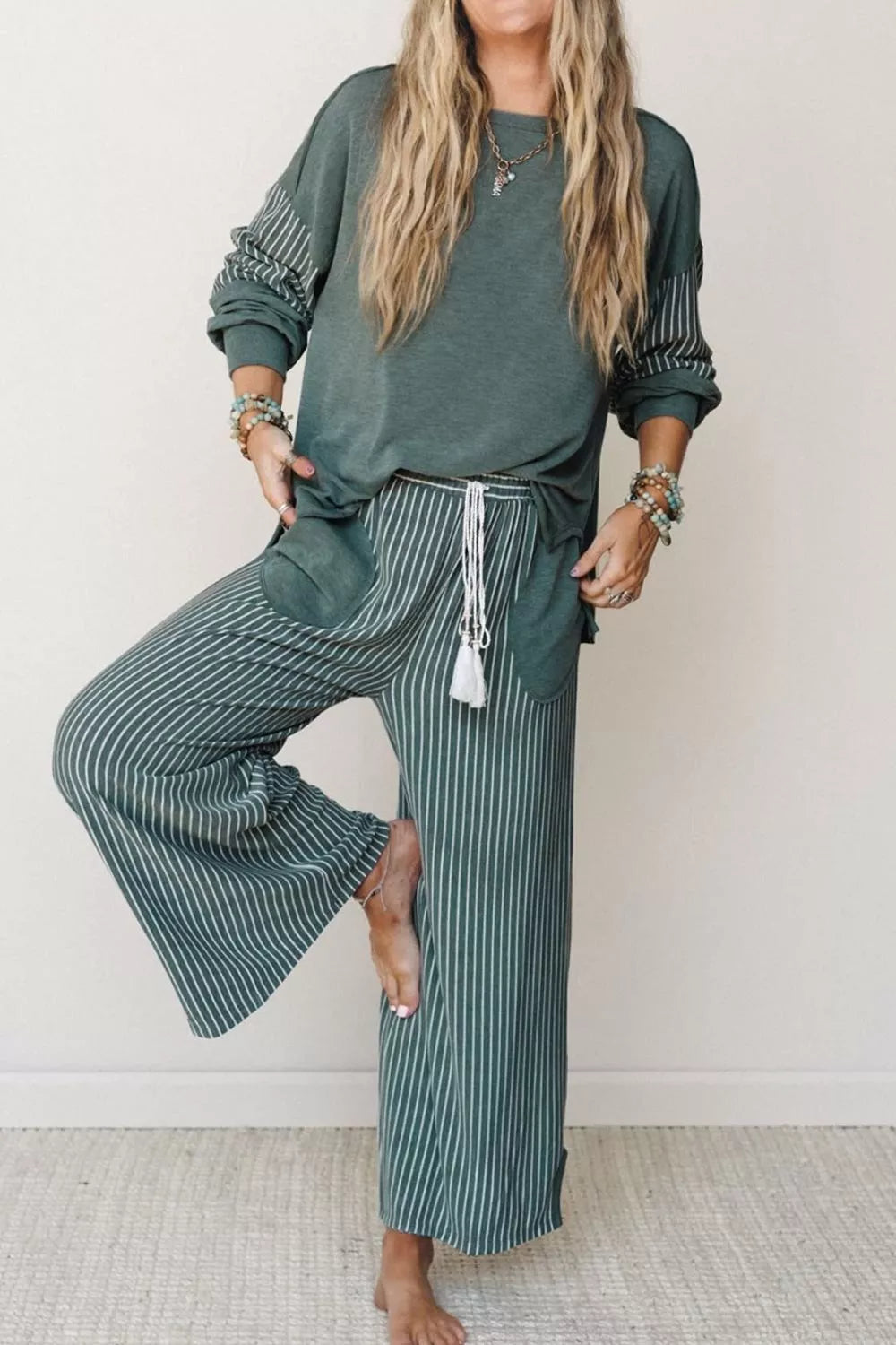 View 5 of the striped two-piece set with a long-sleeve top and drawstring pants.