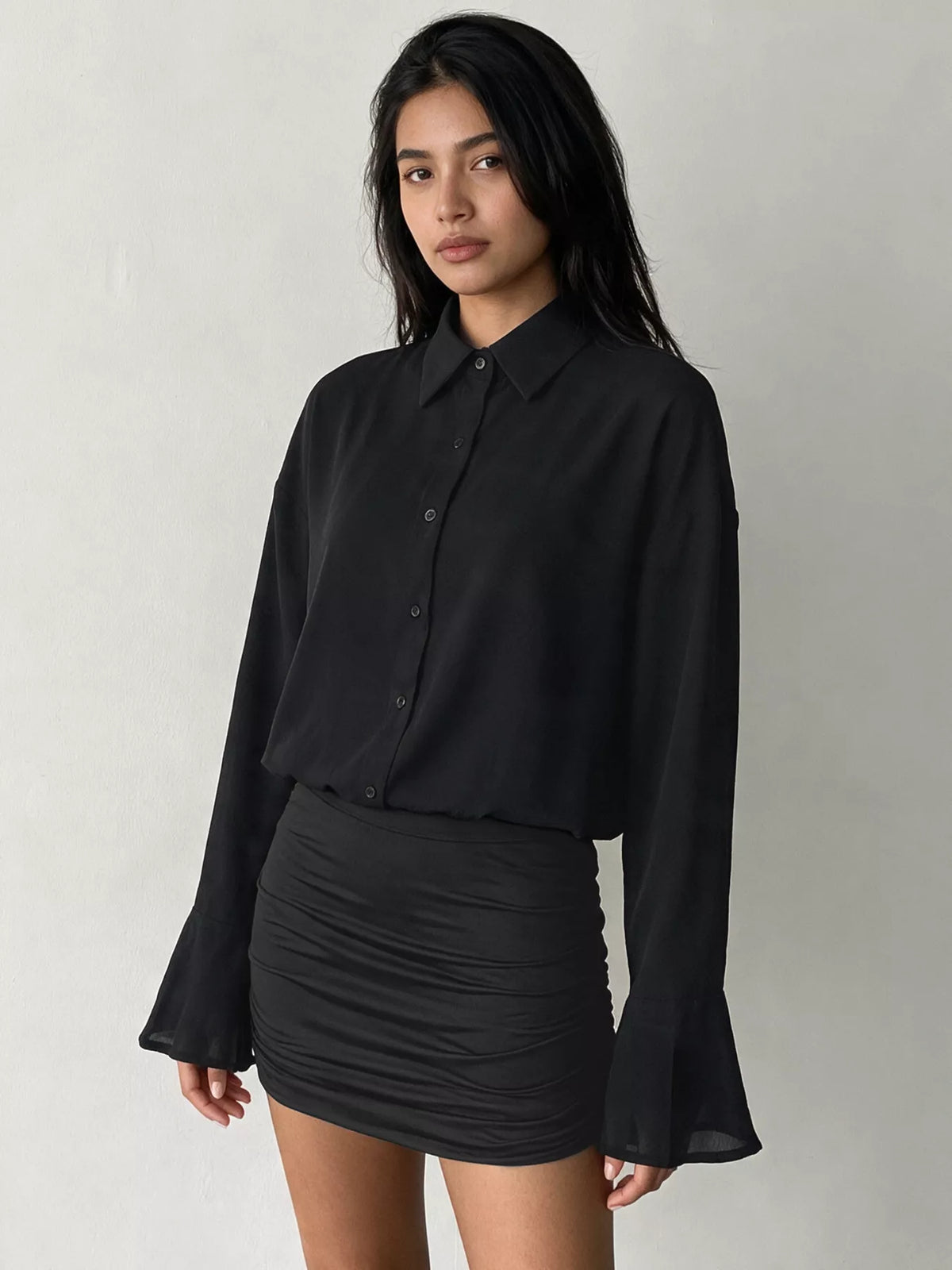 View 2 of the bodycon shirt dress with a button front, flounce sleeves, and ruching.