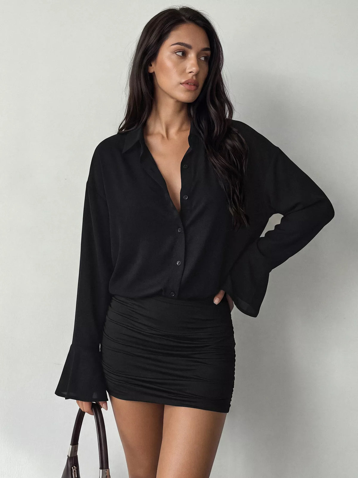 Bodycon shirt dress with a button front, flounce sleeves, and ruching.
