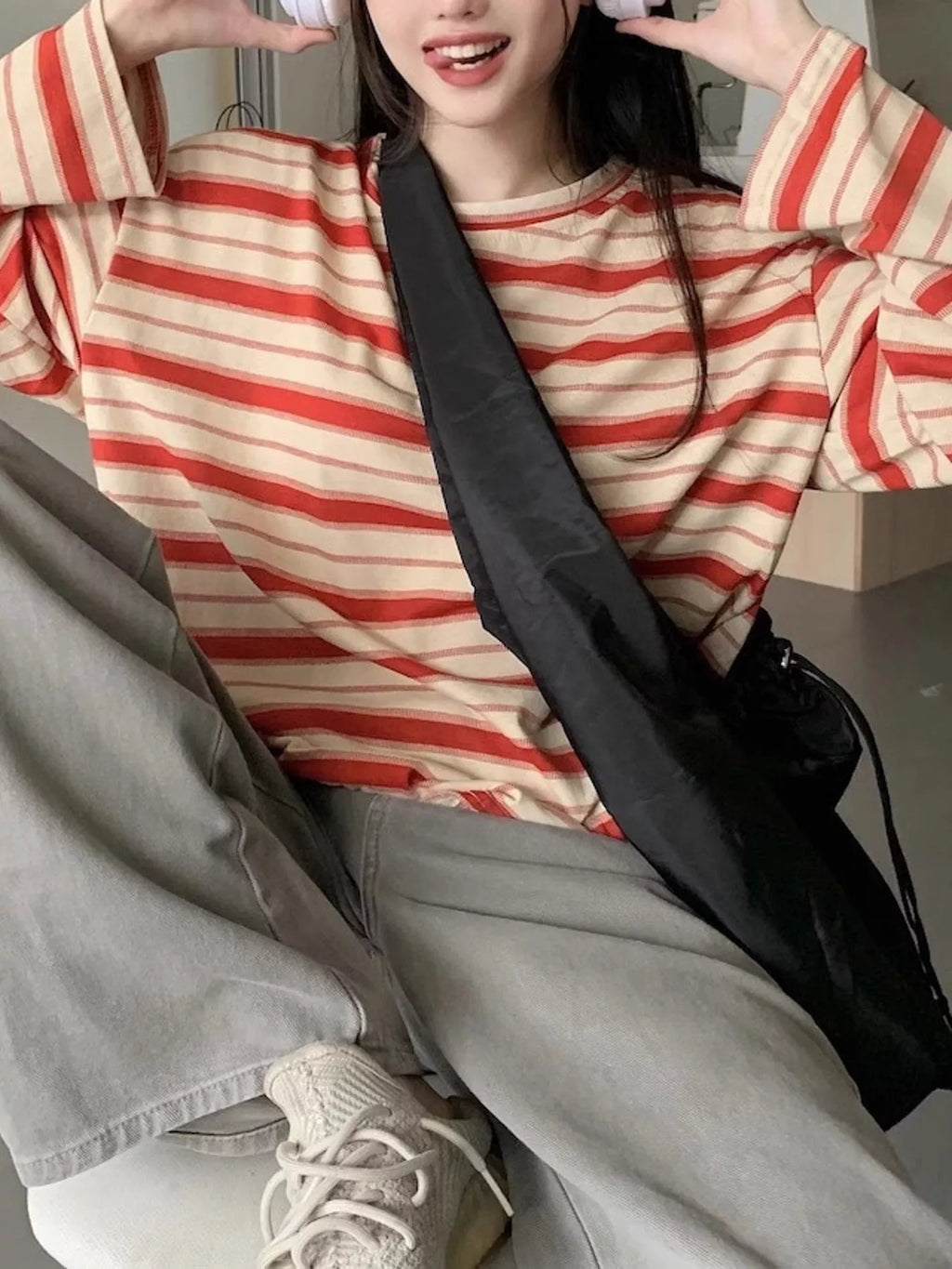 View 20 of the oversized navy-and-cream striped tee with dropped shoulders.