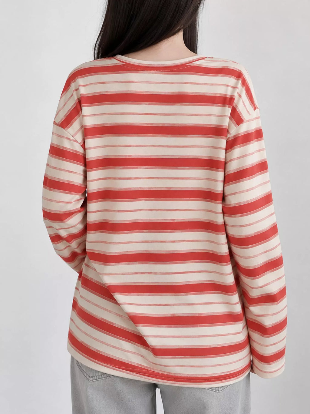 View 16 of the oversized navy-and-cream striped tee with dropped shoulders.