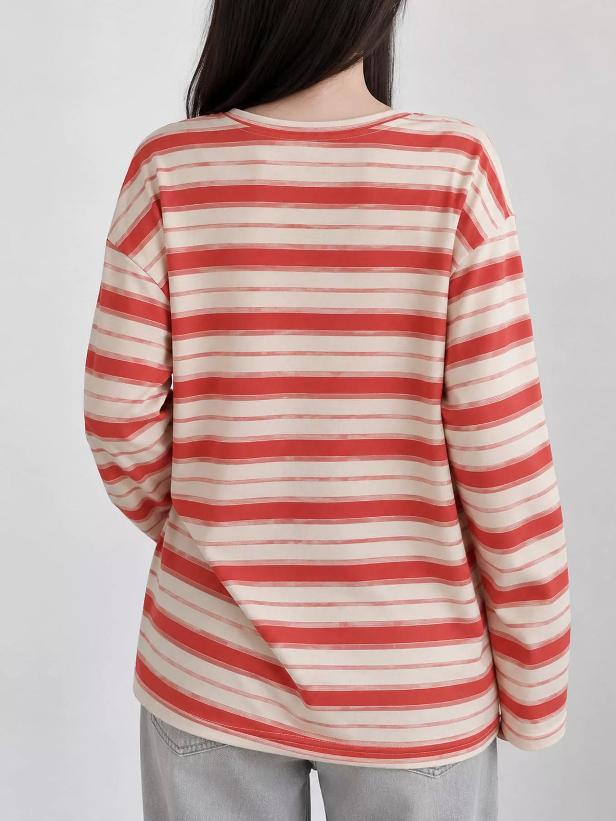 View 16 of the oversized navy-and-cream striped tee with dropped shoulders.