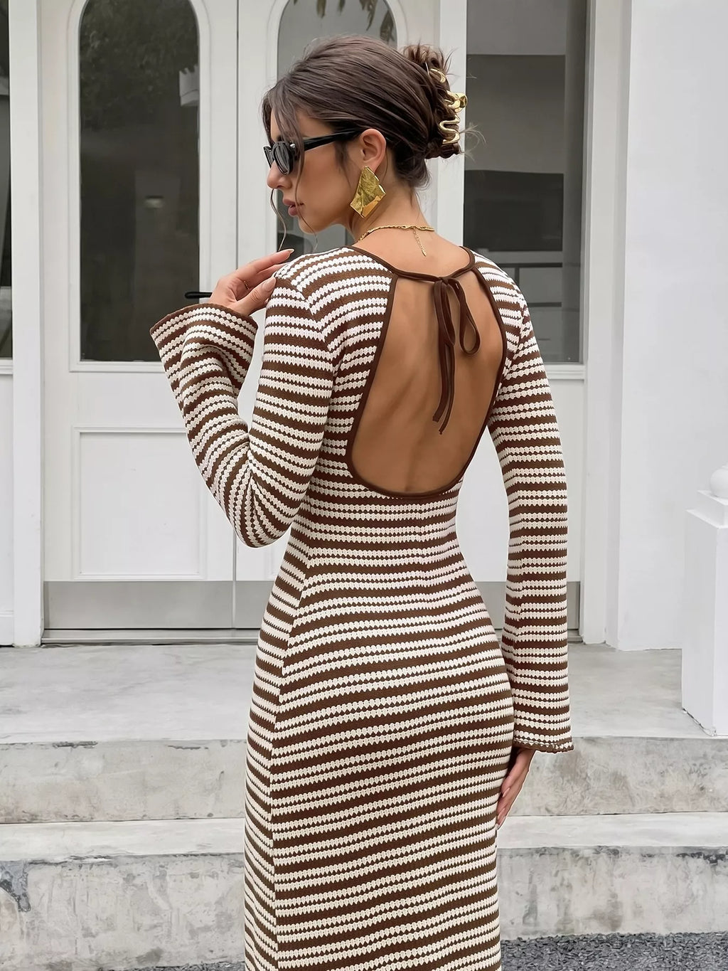 View 5 of the striped ribbed knit dress with flare sleeves.