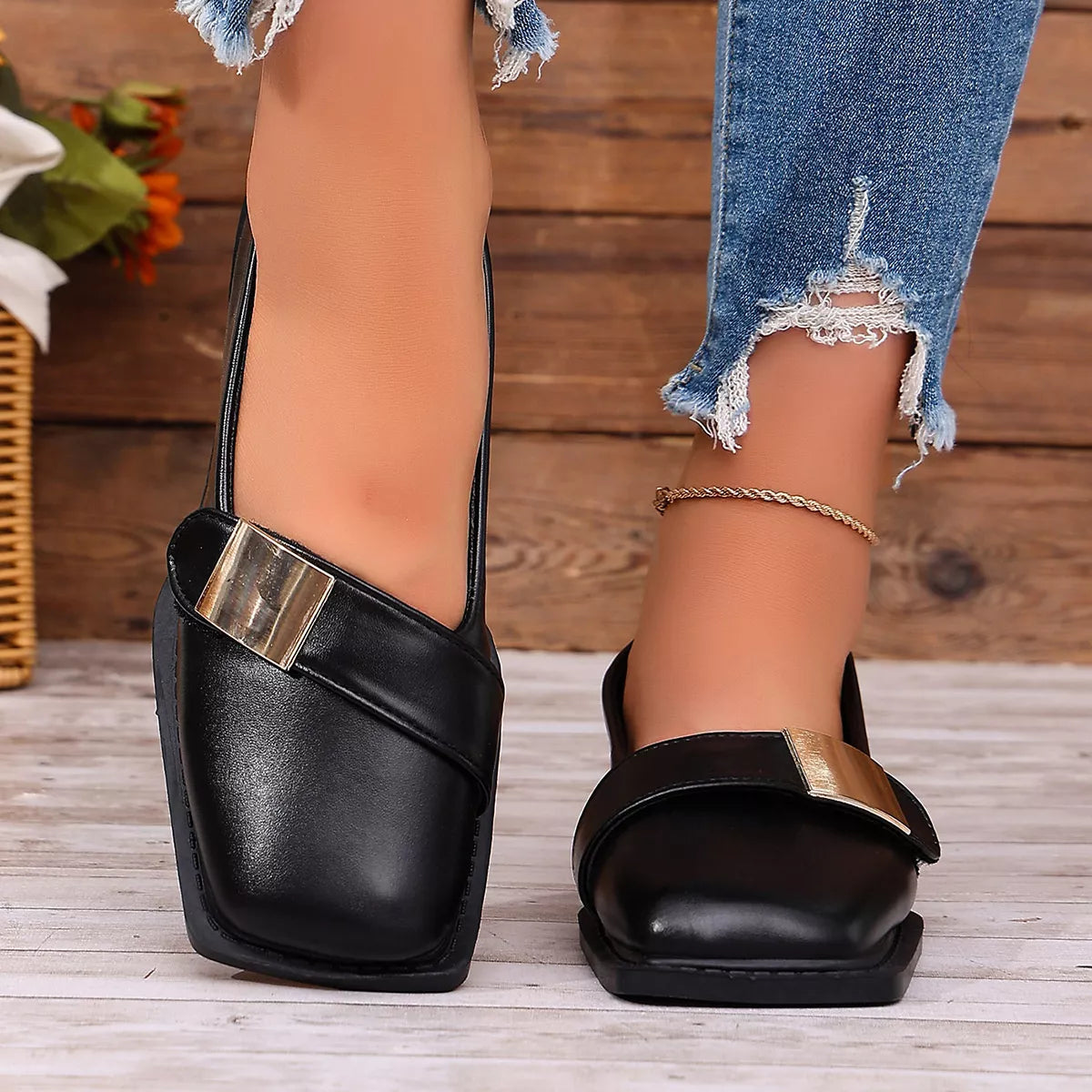 Square-toe slip-on shoes with a low heel.