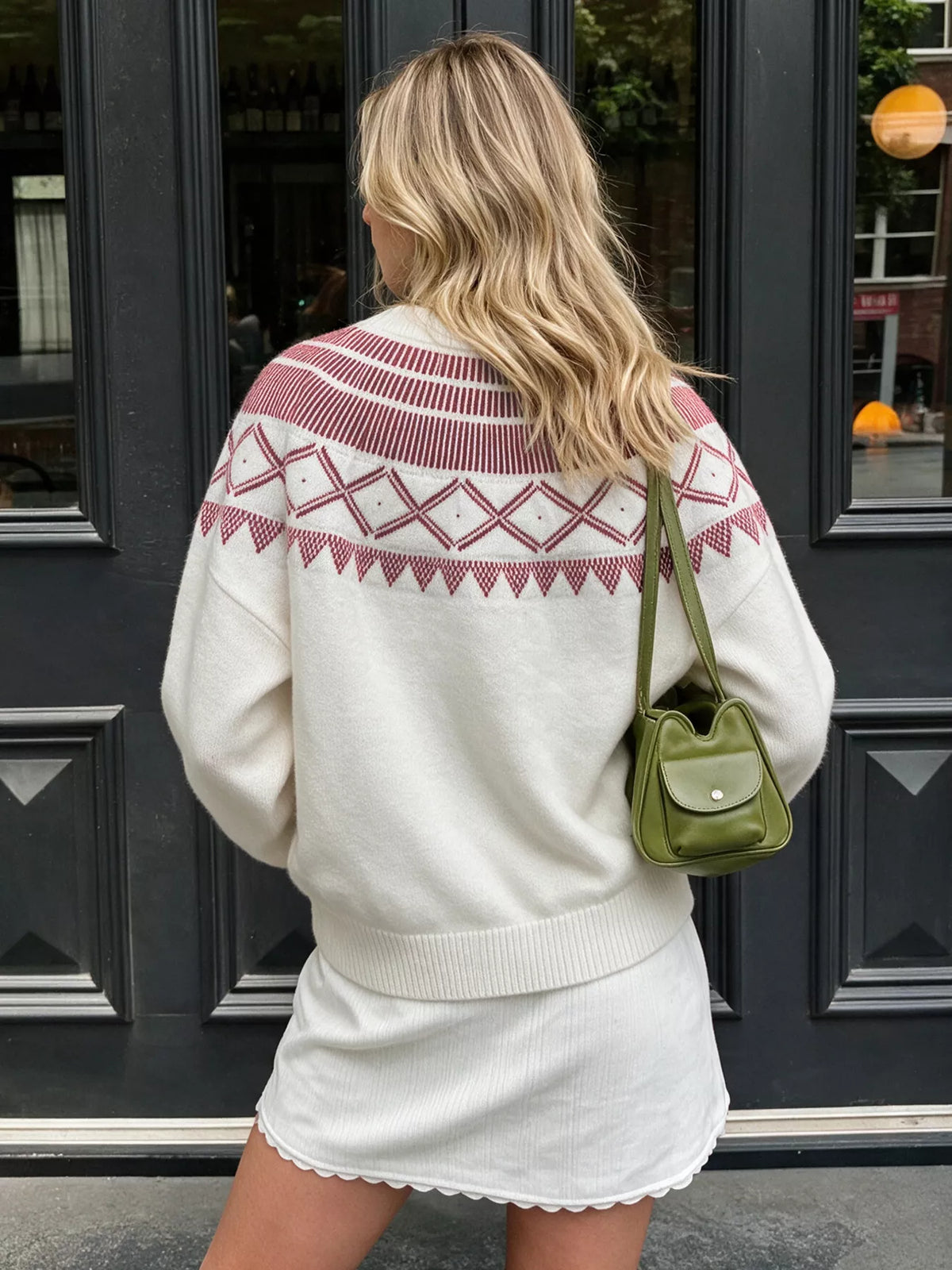 View 7 of the crewneck knit sweater covered in a geometric pattern.