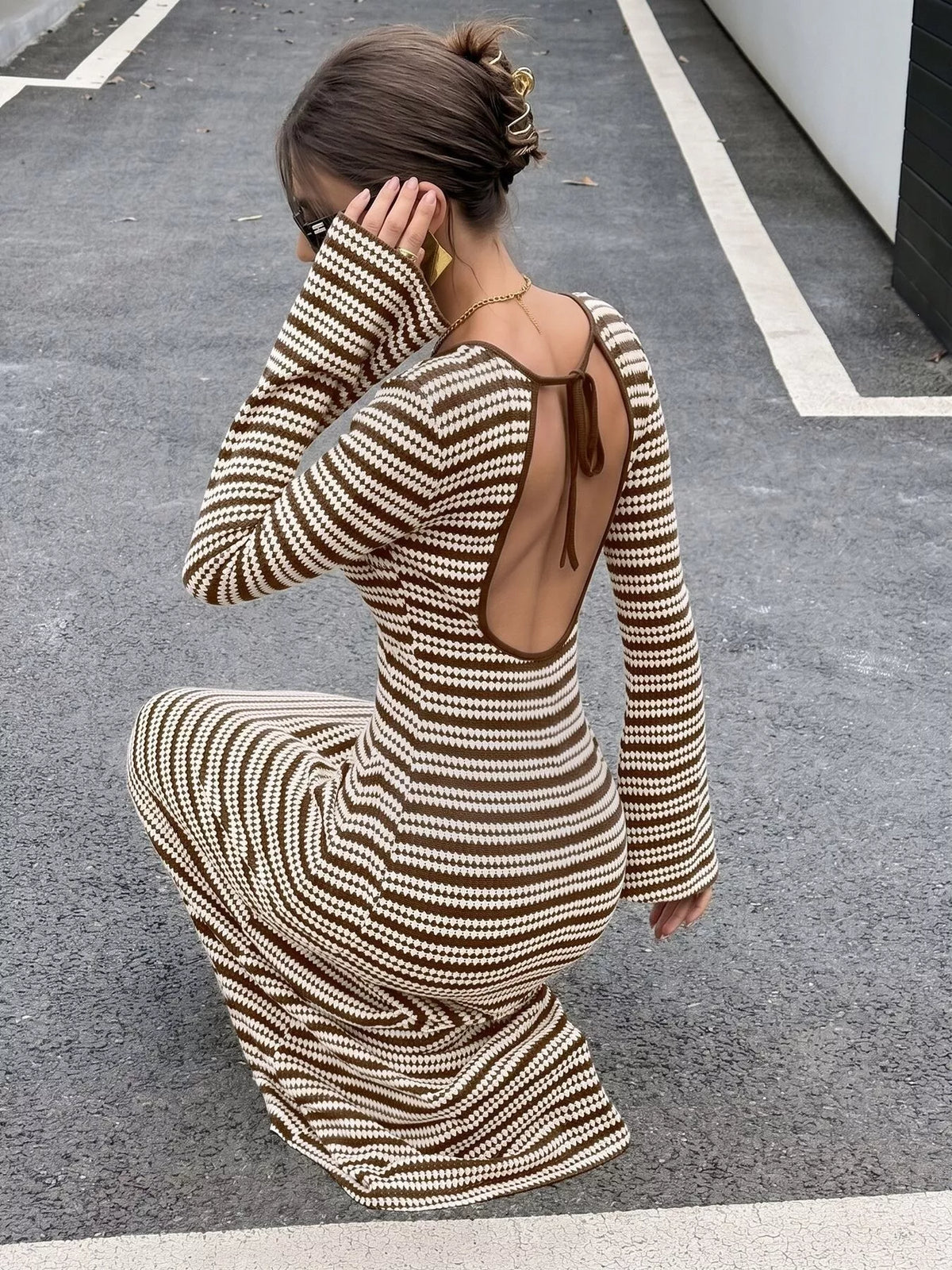 View 4 of the striped ribbed knit dress with flare sleeves.