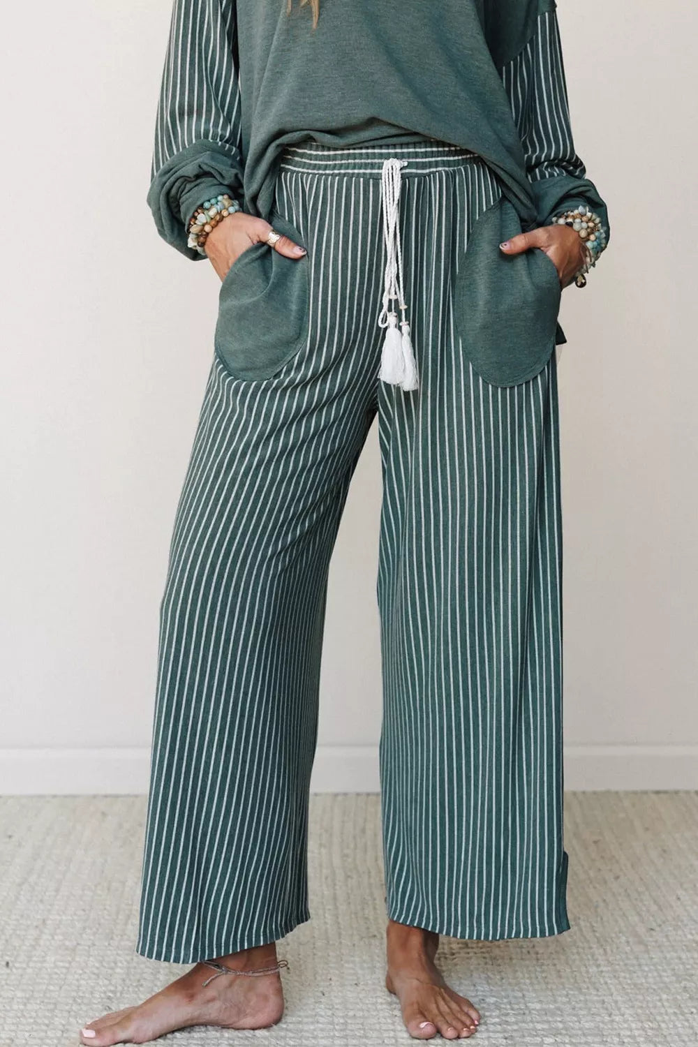 View 8 of the striped two-piece set with a long-sleeve top and drawstring pants.