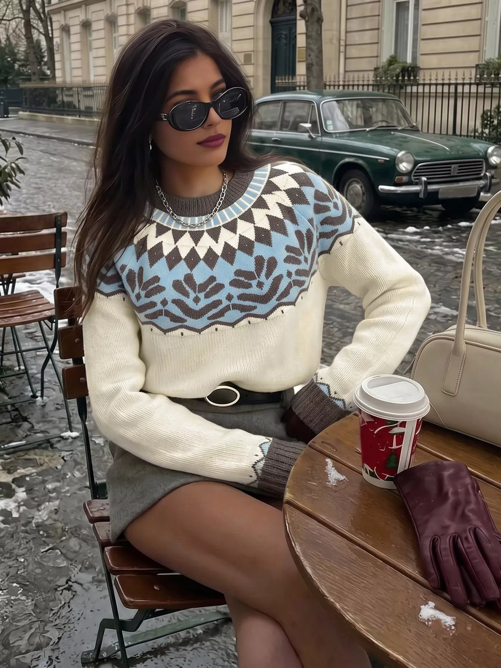 Round-neck Fair Isle sweater with the pattern knitted in, not printed.