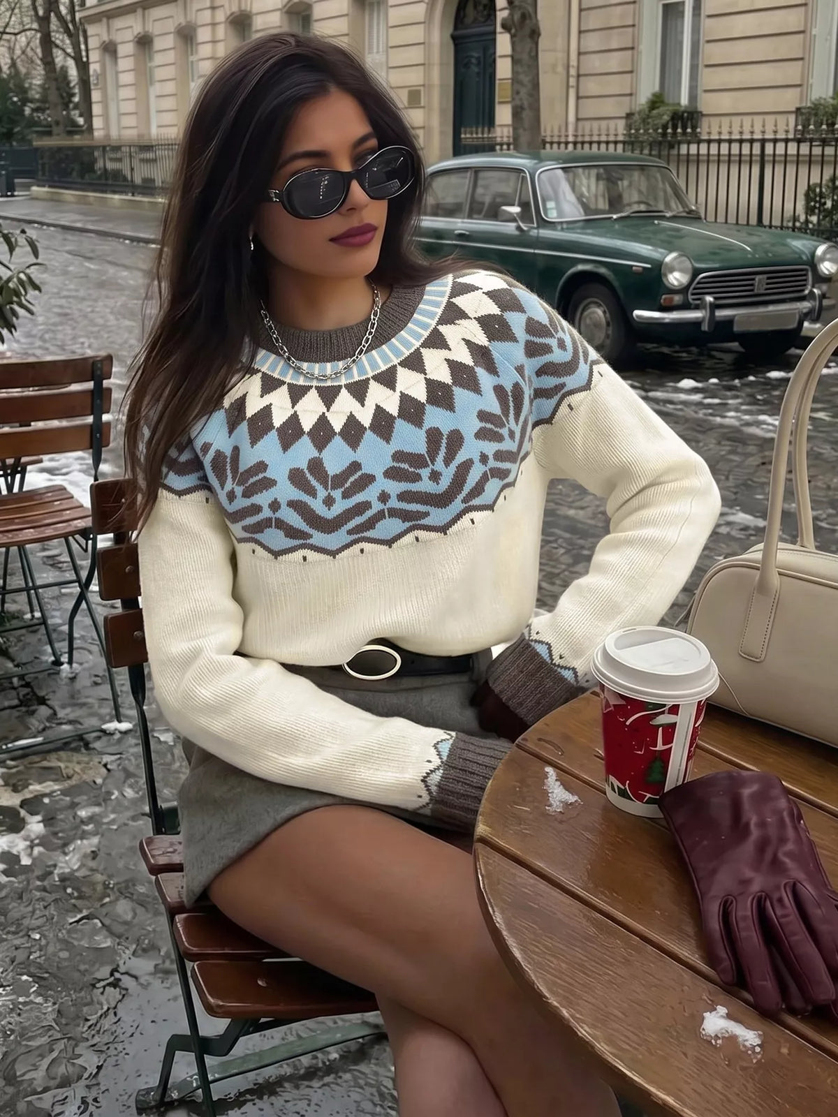 Round-neck Fair Isle sweater with the pattern knitted in, not printed.