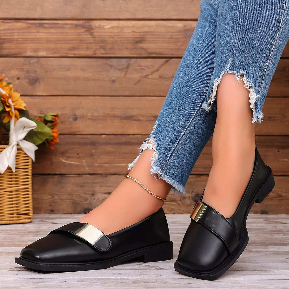 View 2 of the square-toe slip-on shoes with a low heel.
