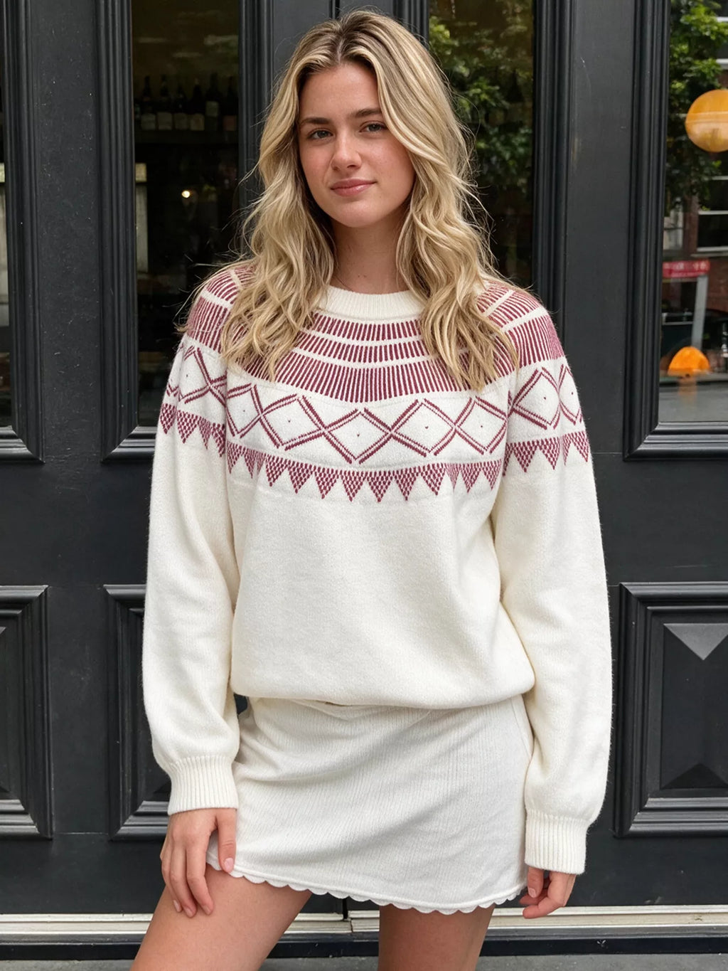 Crewneck knit sweater covered in a geometric pattern.