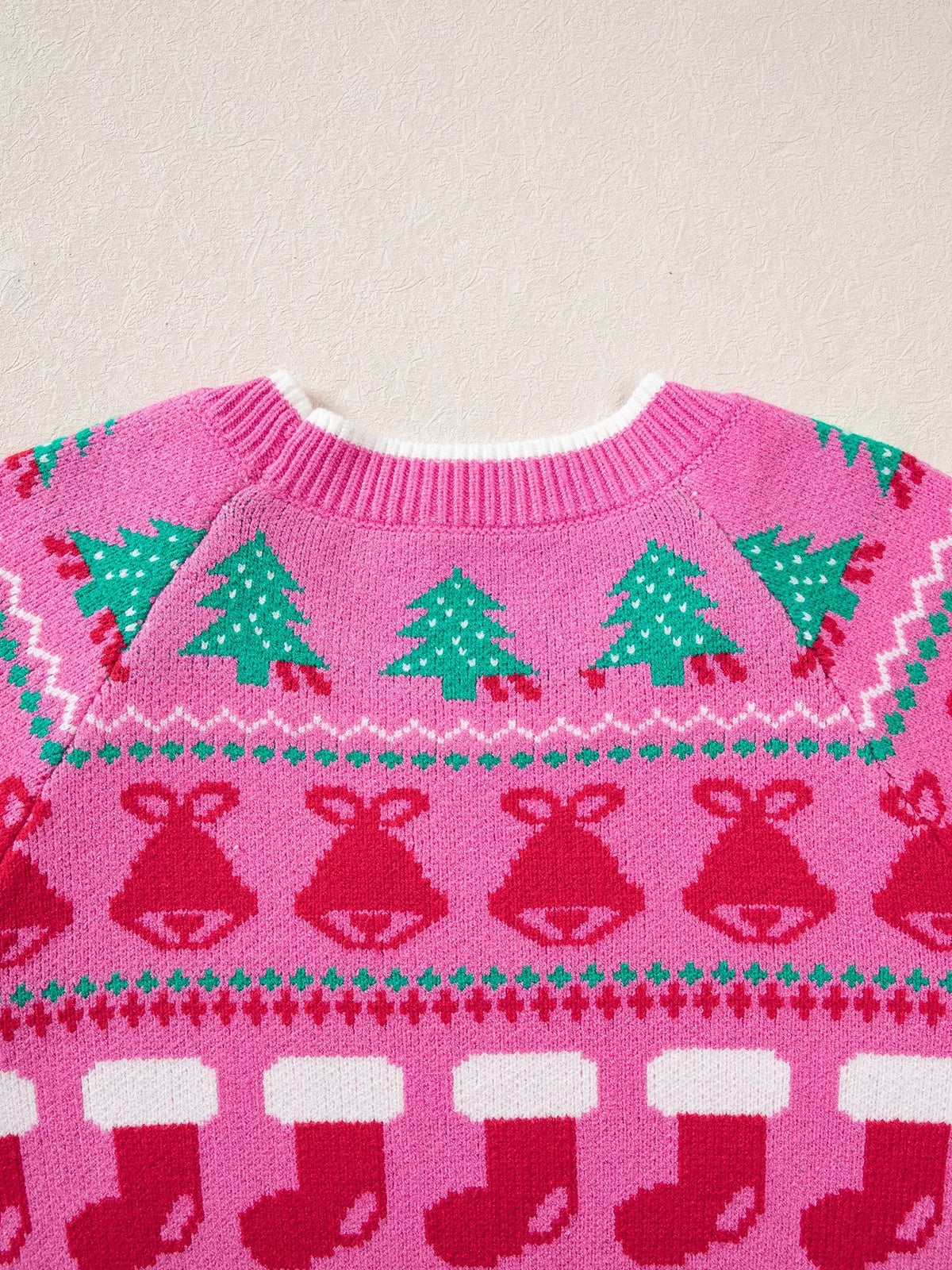 View 6 of the round-neck holiday knit sweater with a graphic across the chest.
