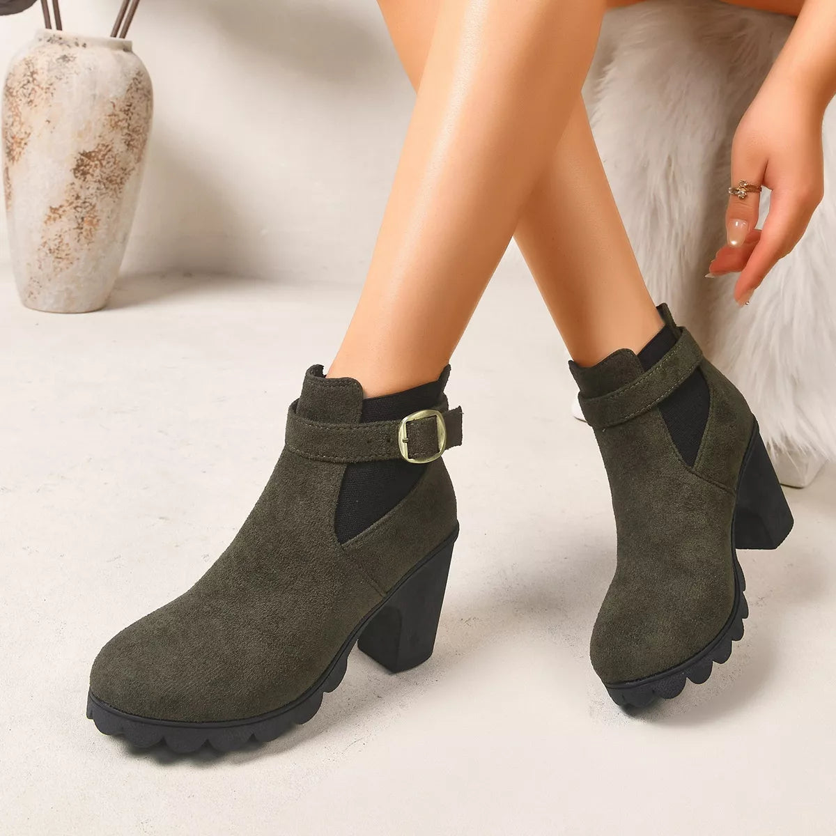View 6 of the suede boots with a round toe and a high block heel.