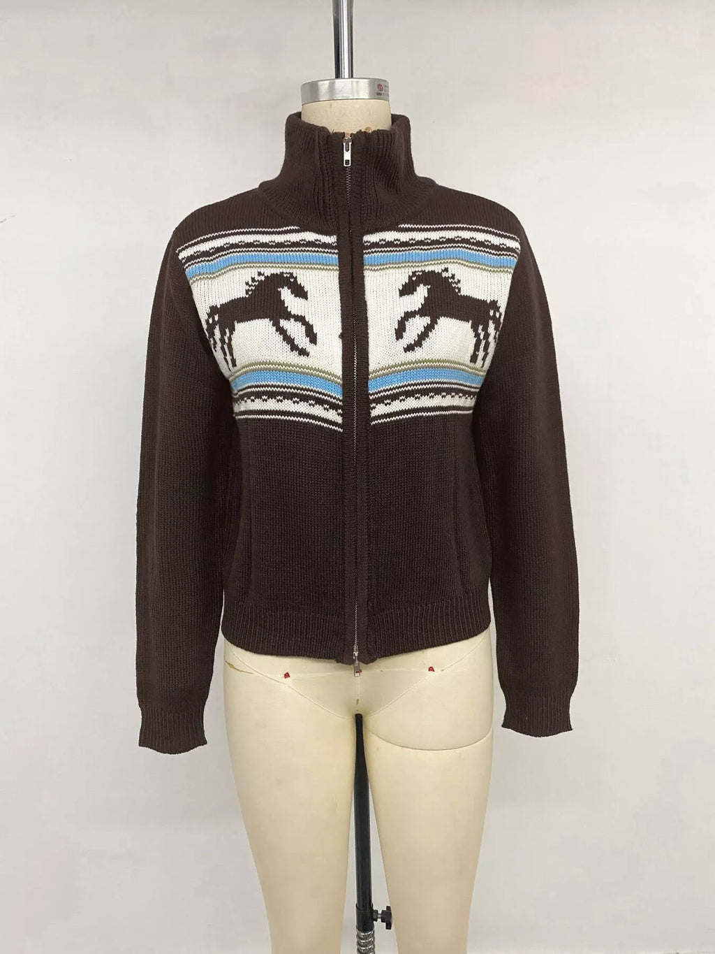 View 11 of the brown zip mock-neck cardigan with black horses on a cream chest band.