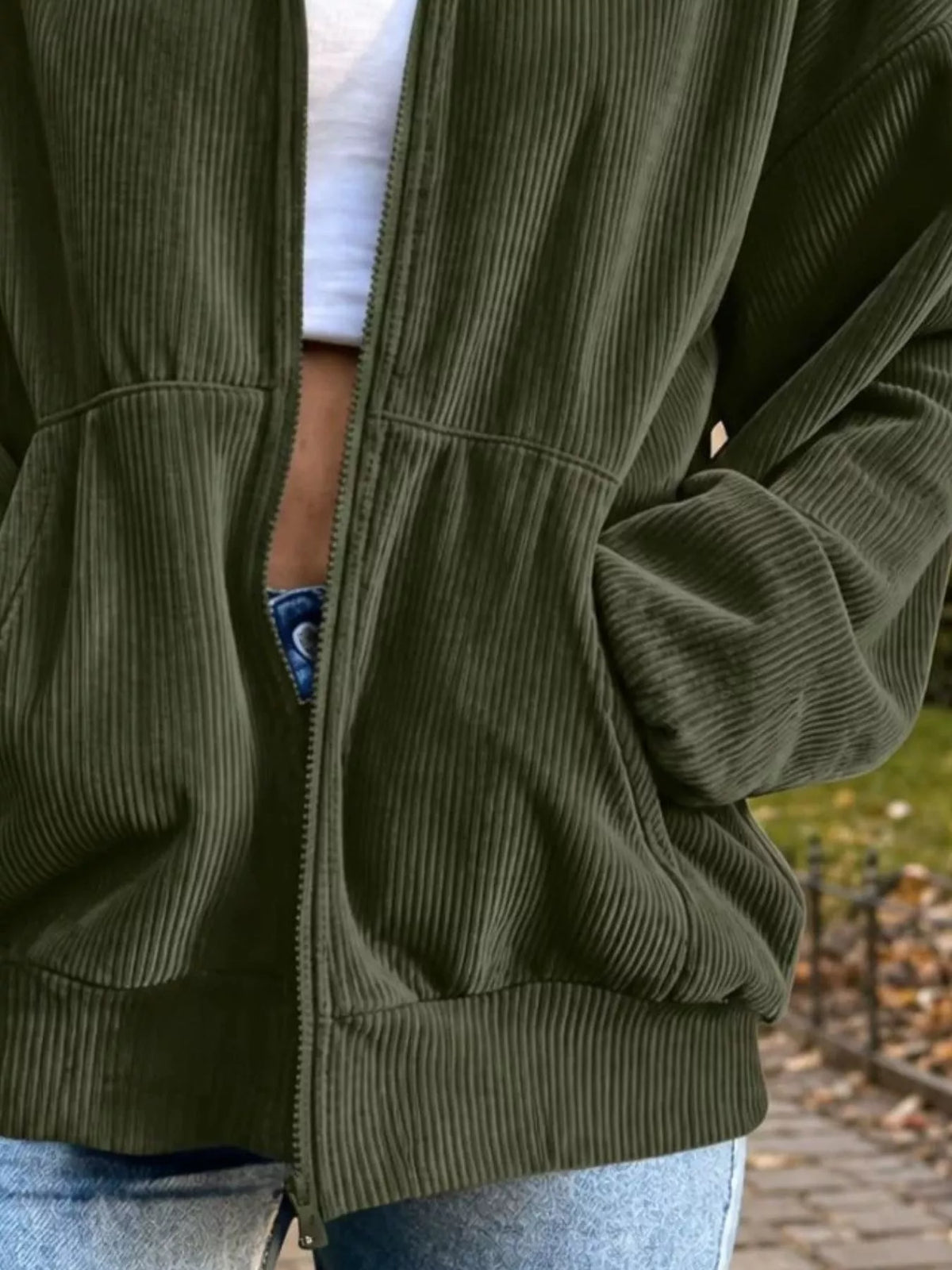 View 21 of the unlined corduroy zip jacket with dropped shoulders and pockets.