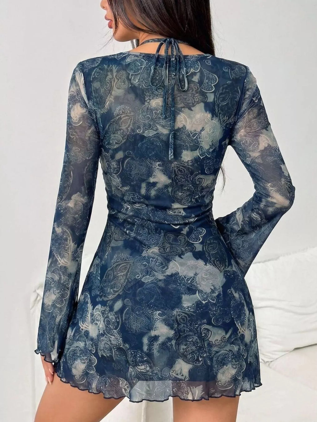 View 4 of the long-sleeve mesh mini dress with cutouts, a tie, and a lining.