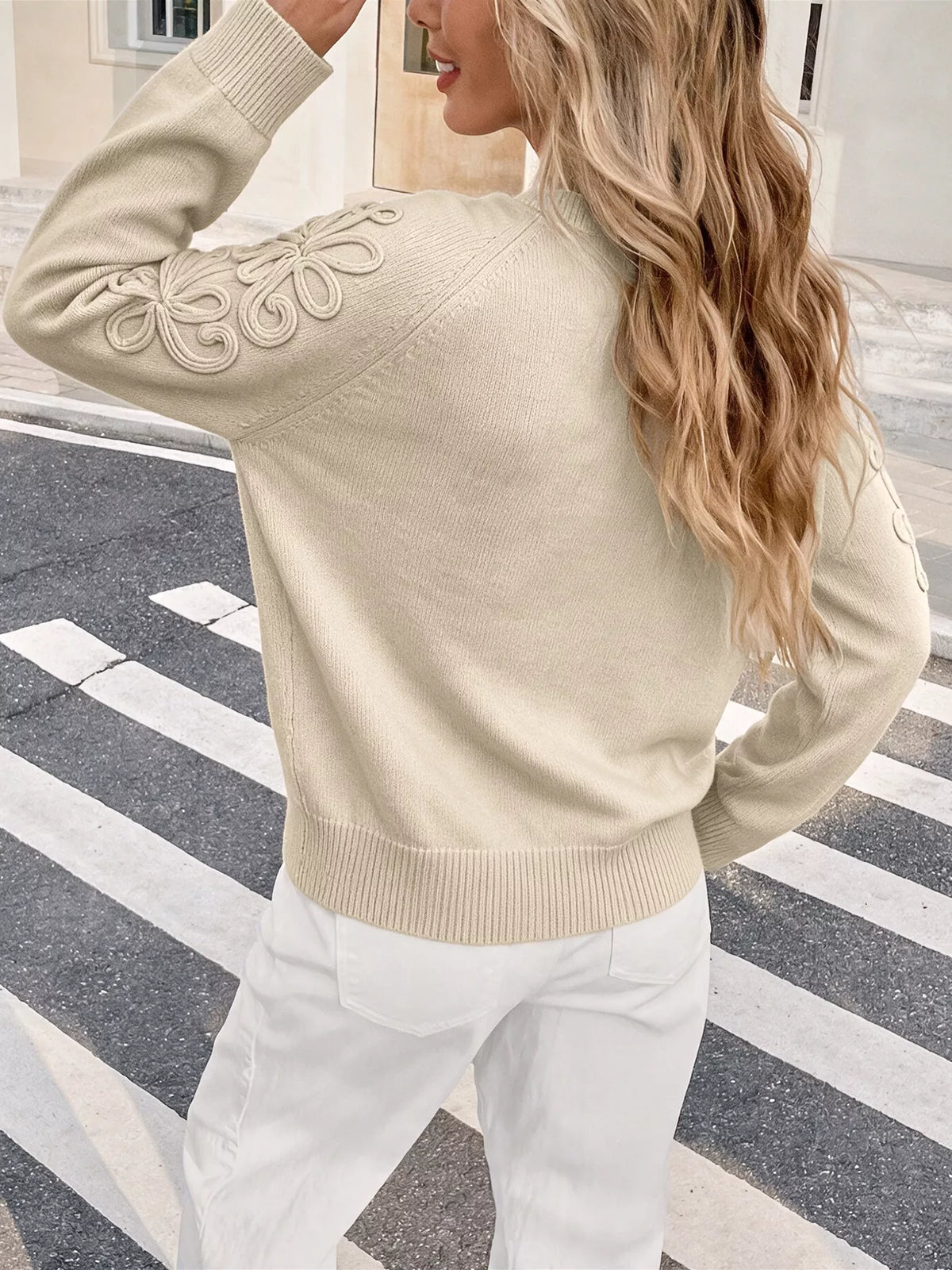 View 5 of the floral appliqué sweater with raglan sleeves.