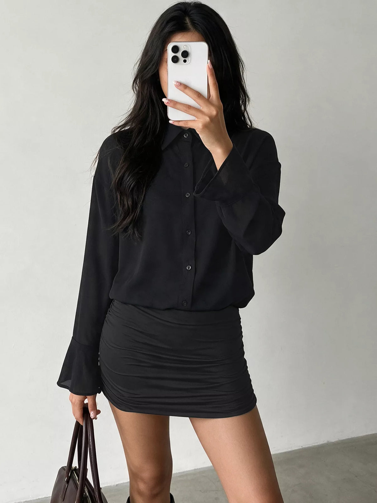 View 3 of the bodycon shirt dress with a button front, flounce sleeves, and ruching.