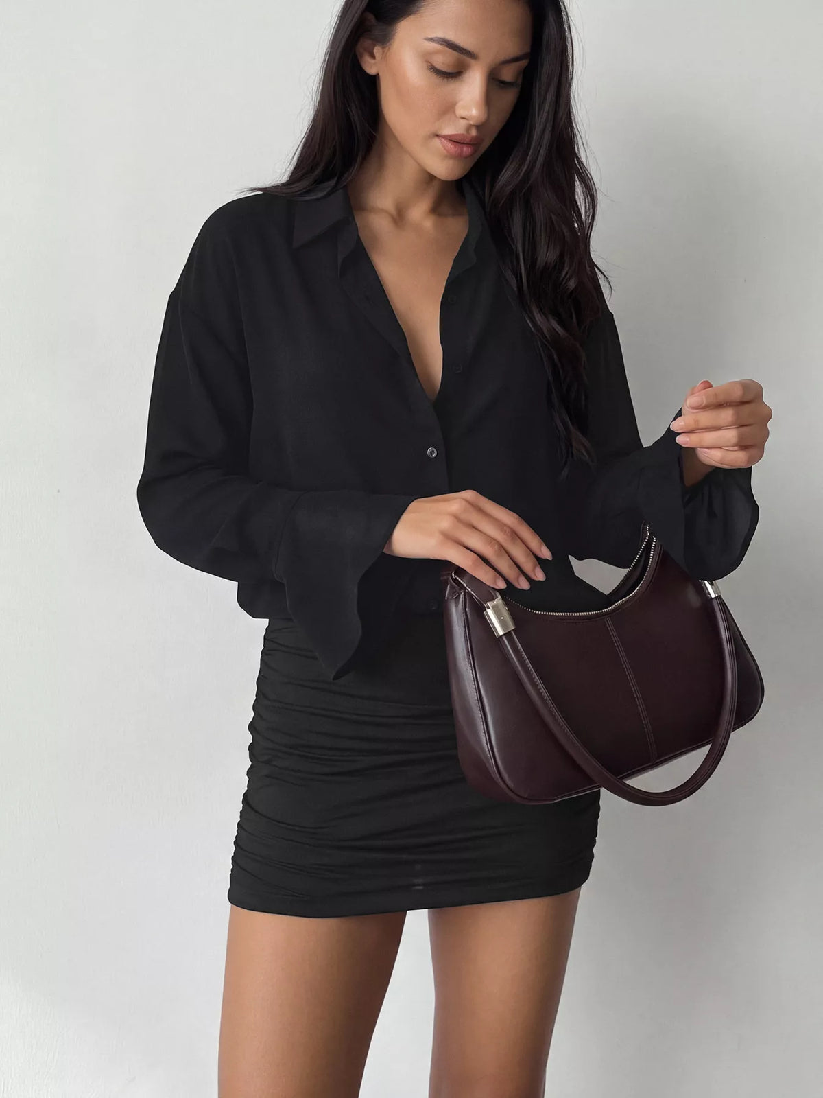 View 5 of the bodycon shirt dress with a button front, flounce sleeves, and ruching.