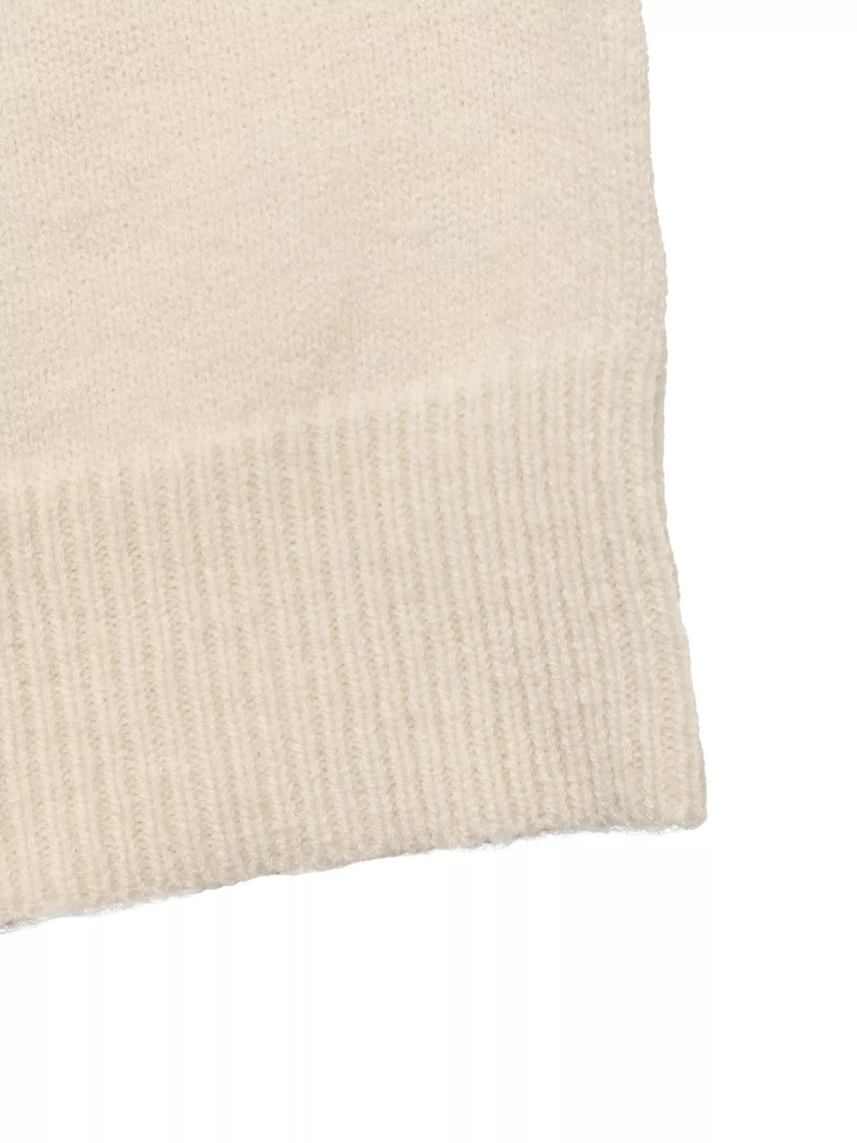 View 10 of the crewneck sweater with a heart pattern through the knit.