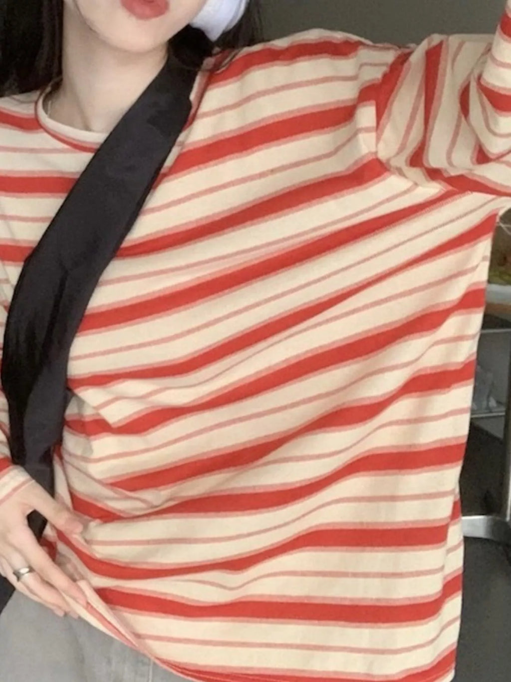 View 19 of the oversized navy-and-cream striped tee with dropped shoulders.