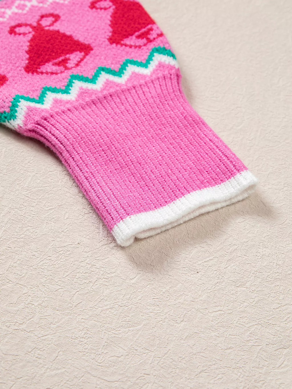 View 9 of the round-neck holiday knit sweater with a graphic across the chest.